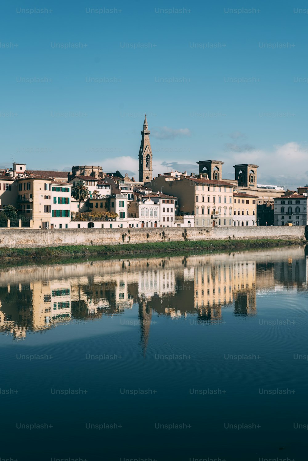 a large body of water with a city in the background