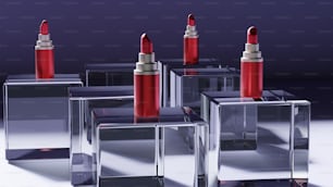 a group of four red lipsticks sitting on top of each other