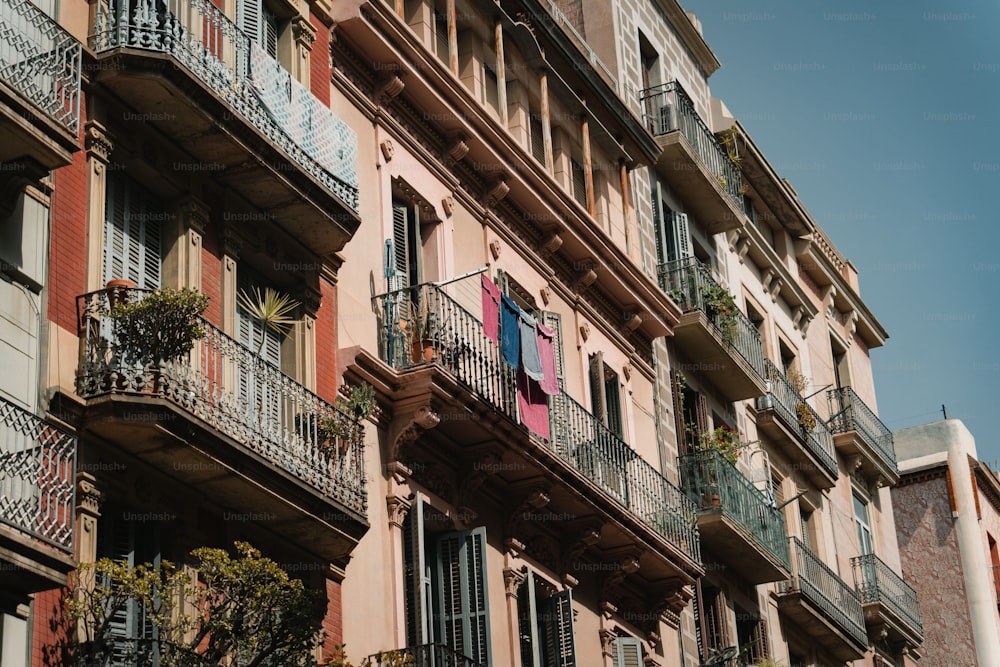 a row of buildings with balconies and balconies on the balcon