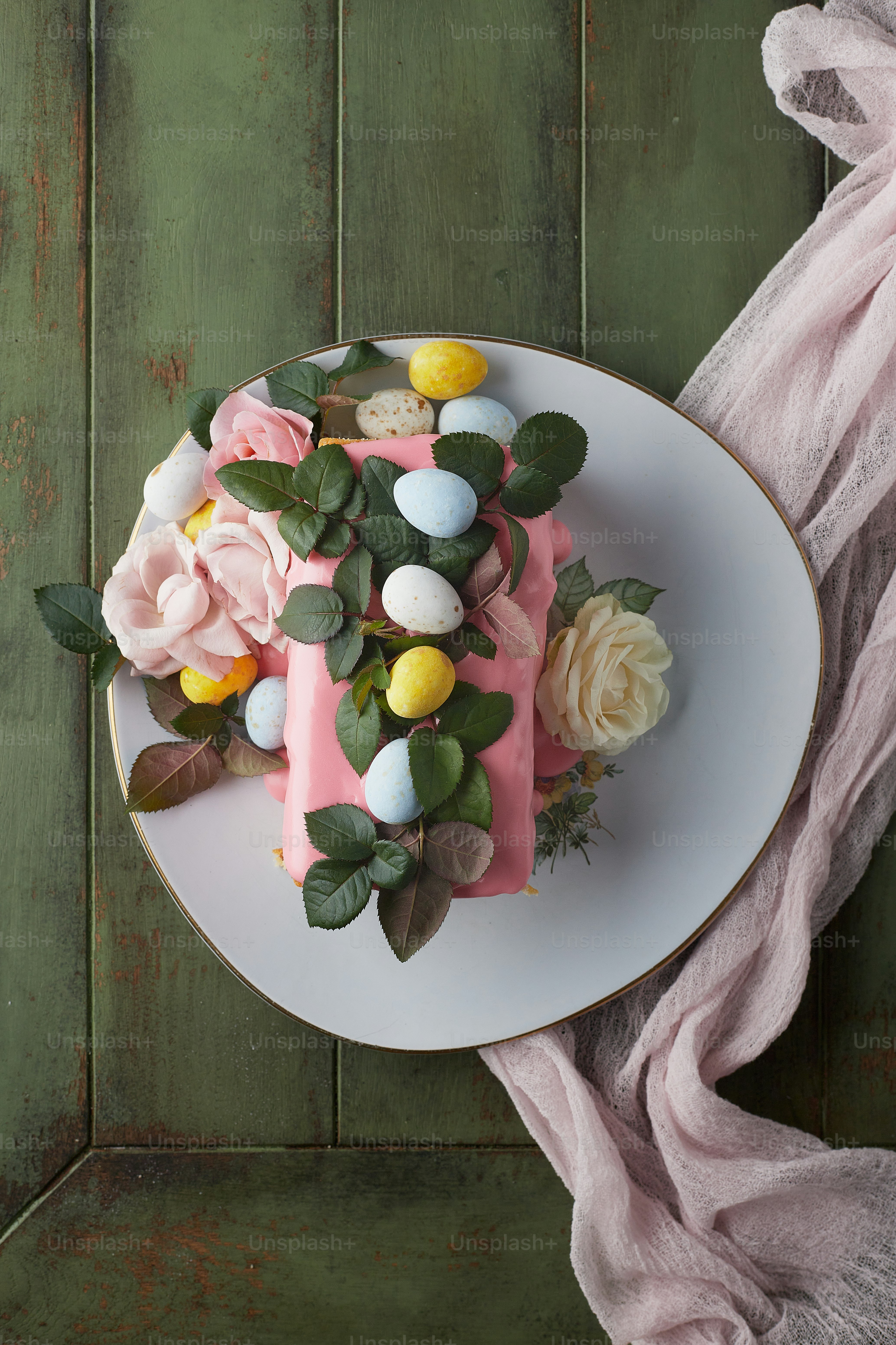 a white plate topped with a cake covered in flowers