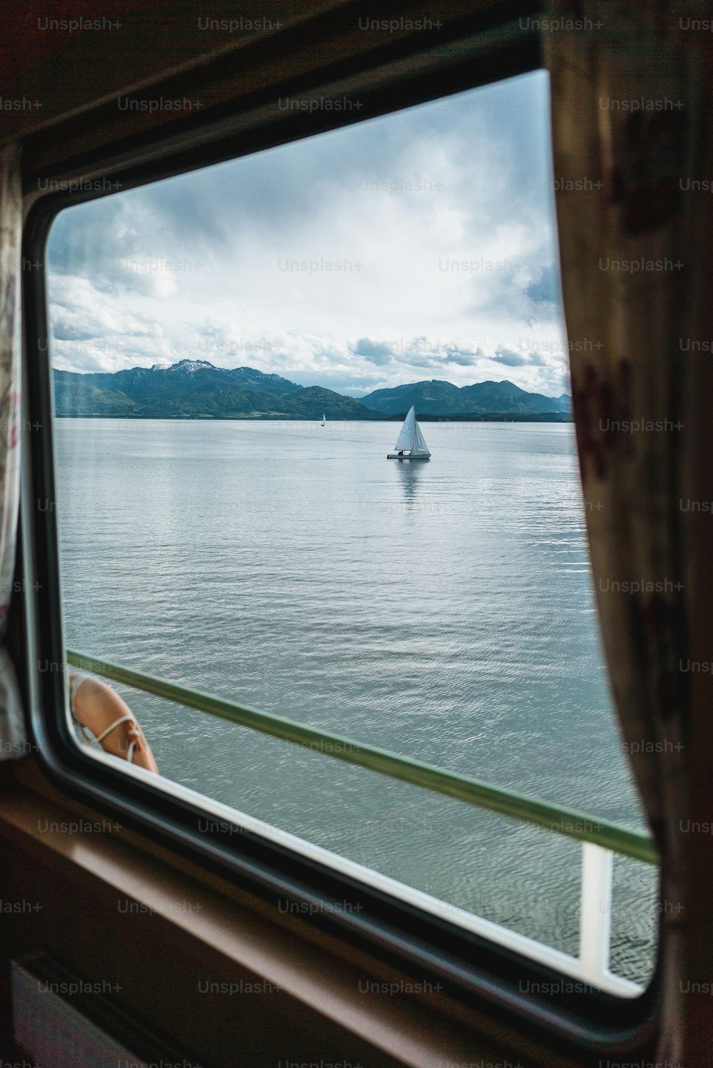 a view of a body of water from a train window