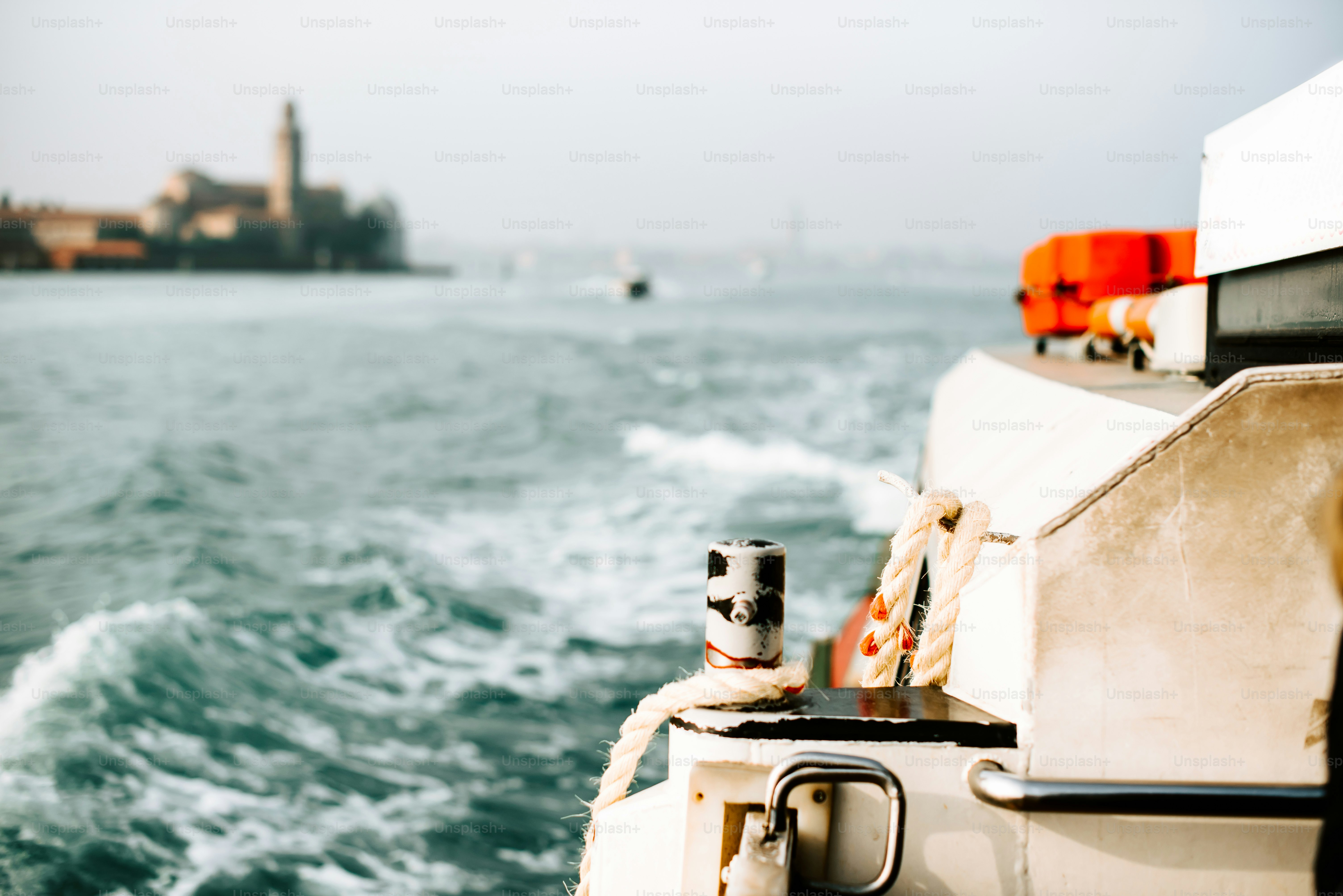 a boat traveling on a body of water