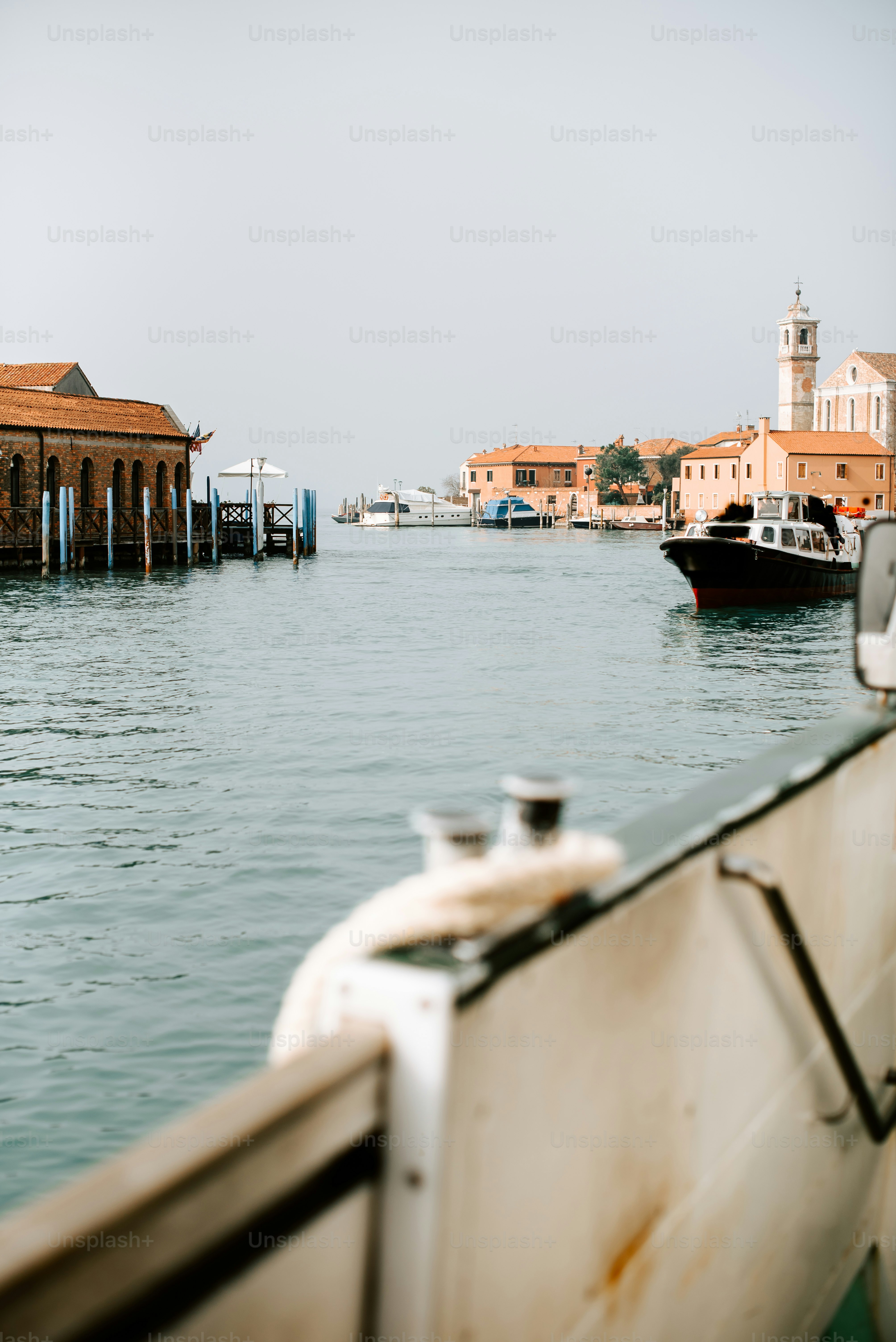 a boat in a body of water next to a building