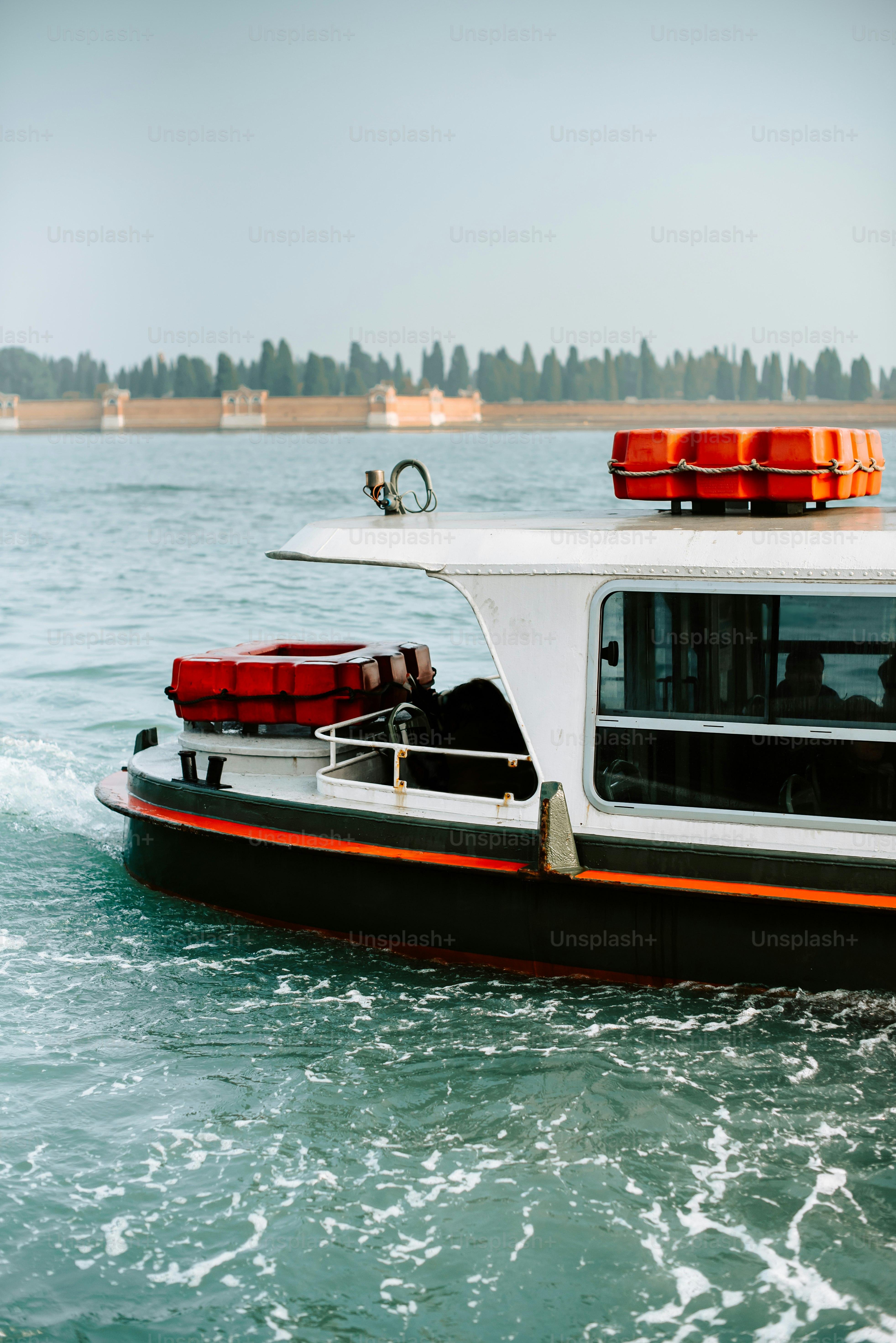 a white and black boat in the water