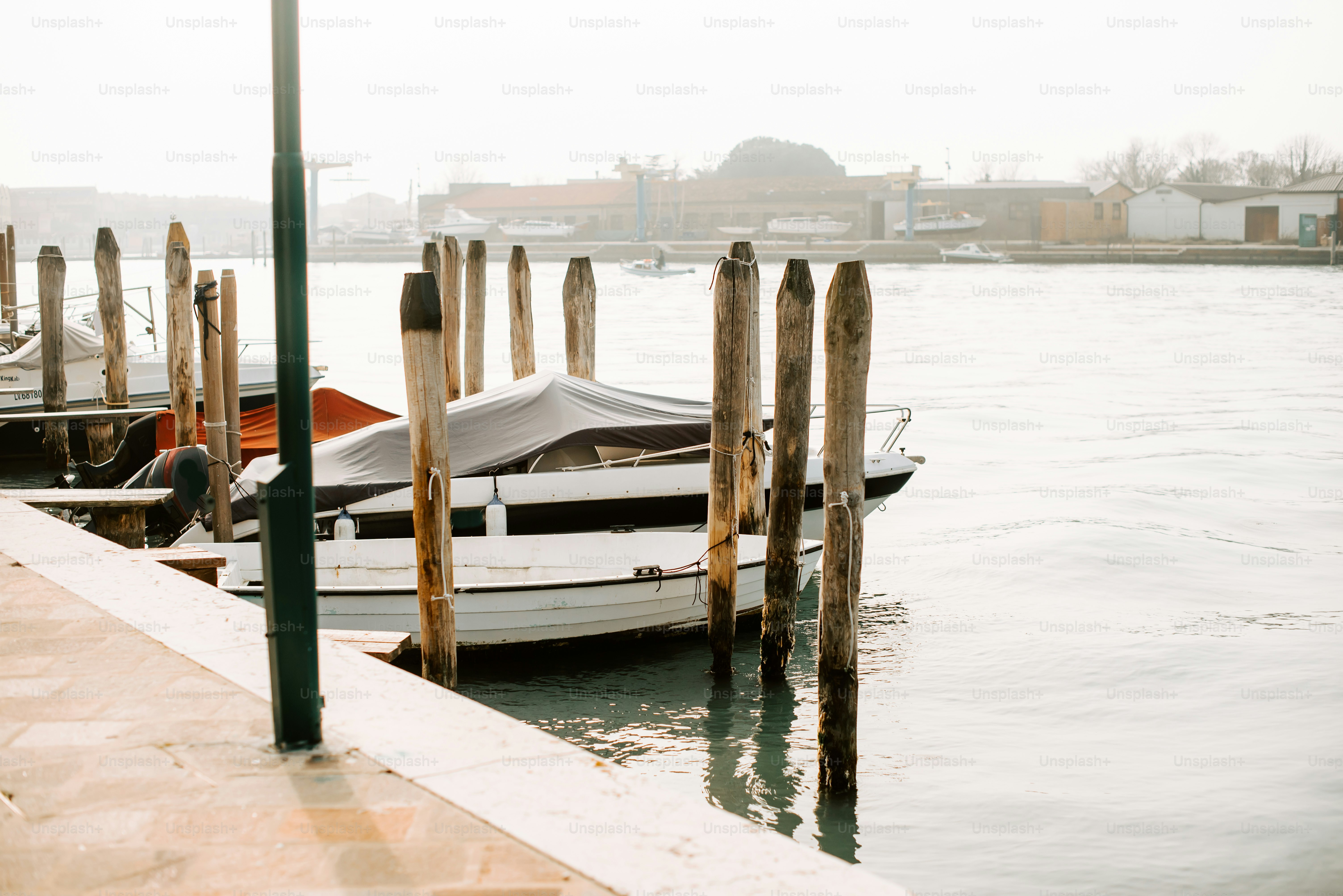 a boat tied up to a dock in the water