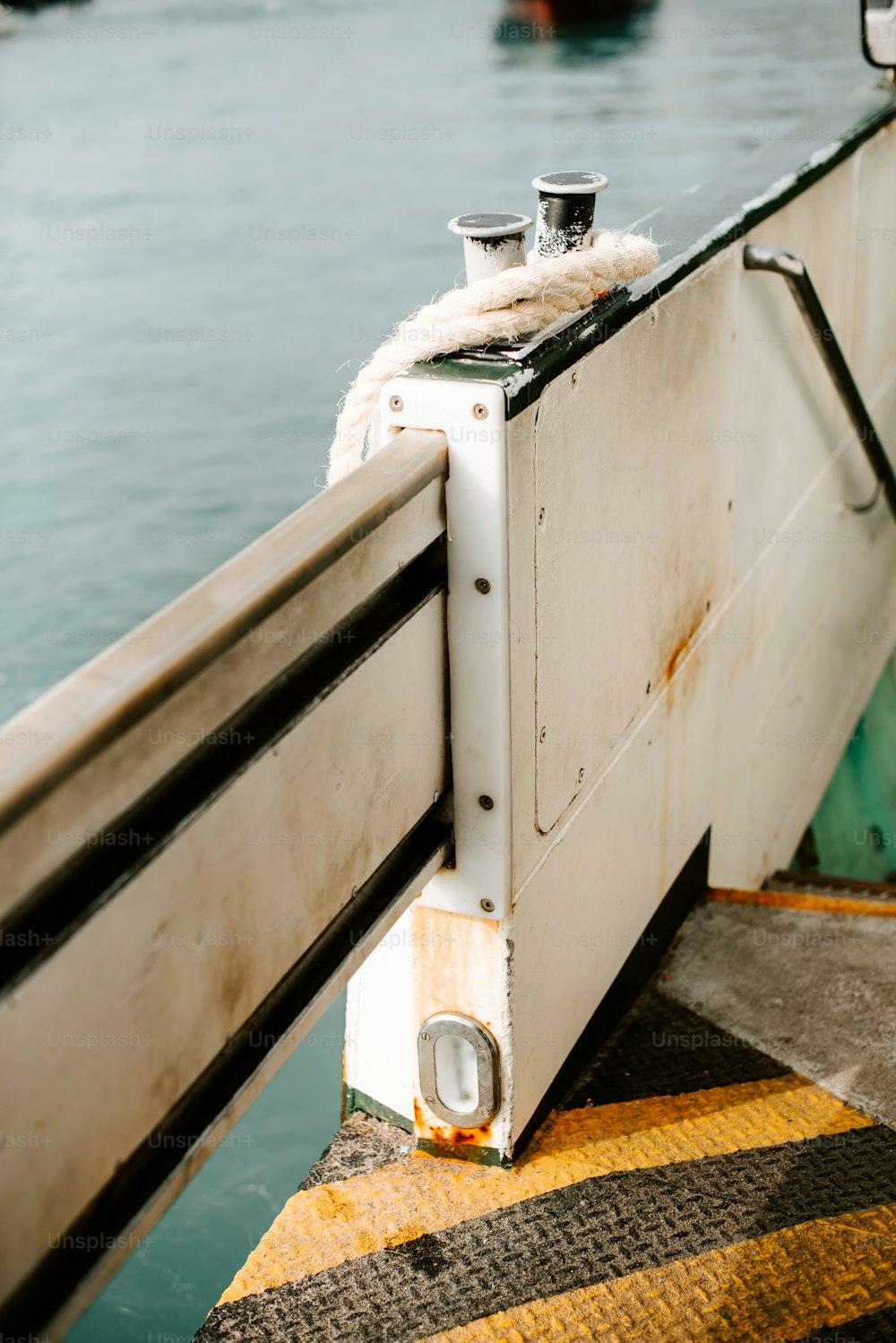 a close up of a boat door with a rope on it