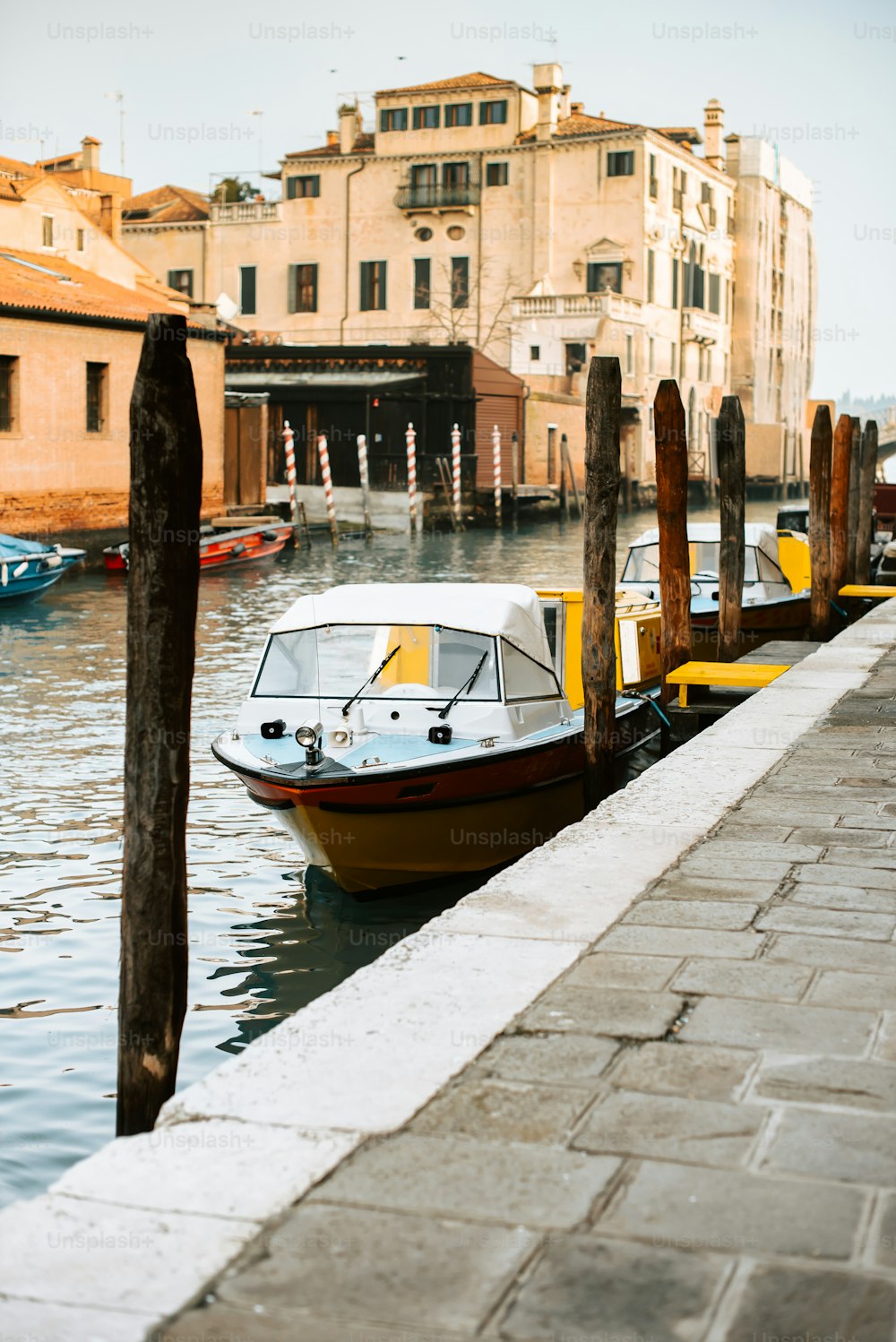 a small boat is tied to a dock