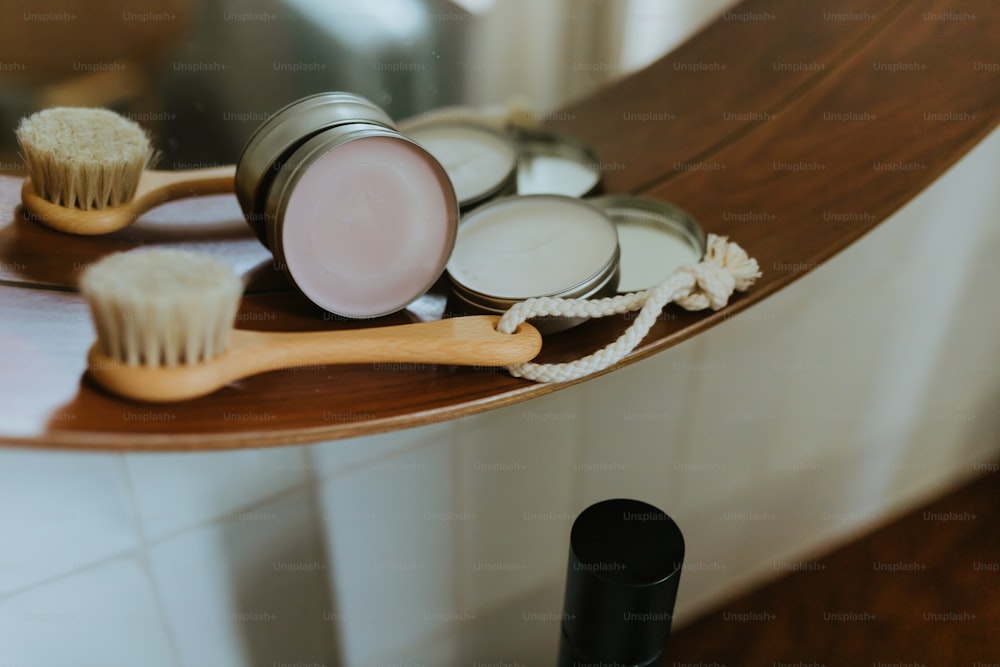 a close up of a wooden shelf with a brush