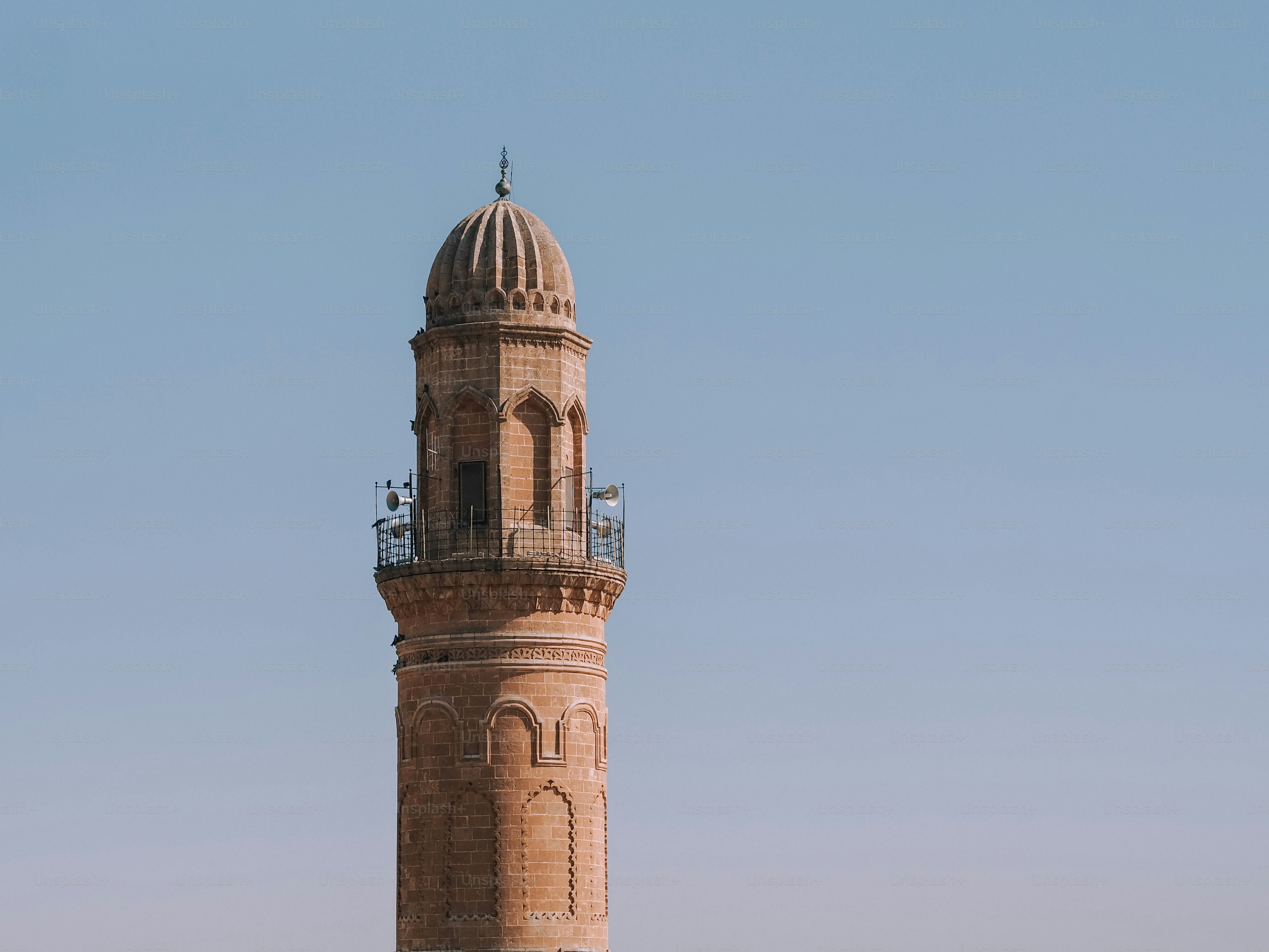 a tall tower with a clock on the top of it
