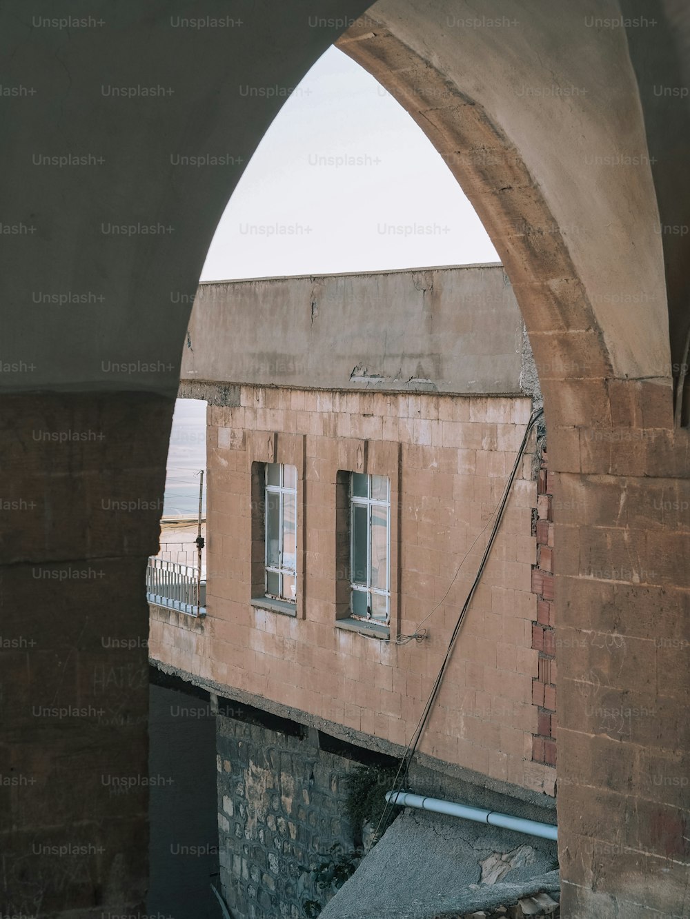 a view of a building through an arch