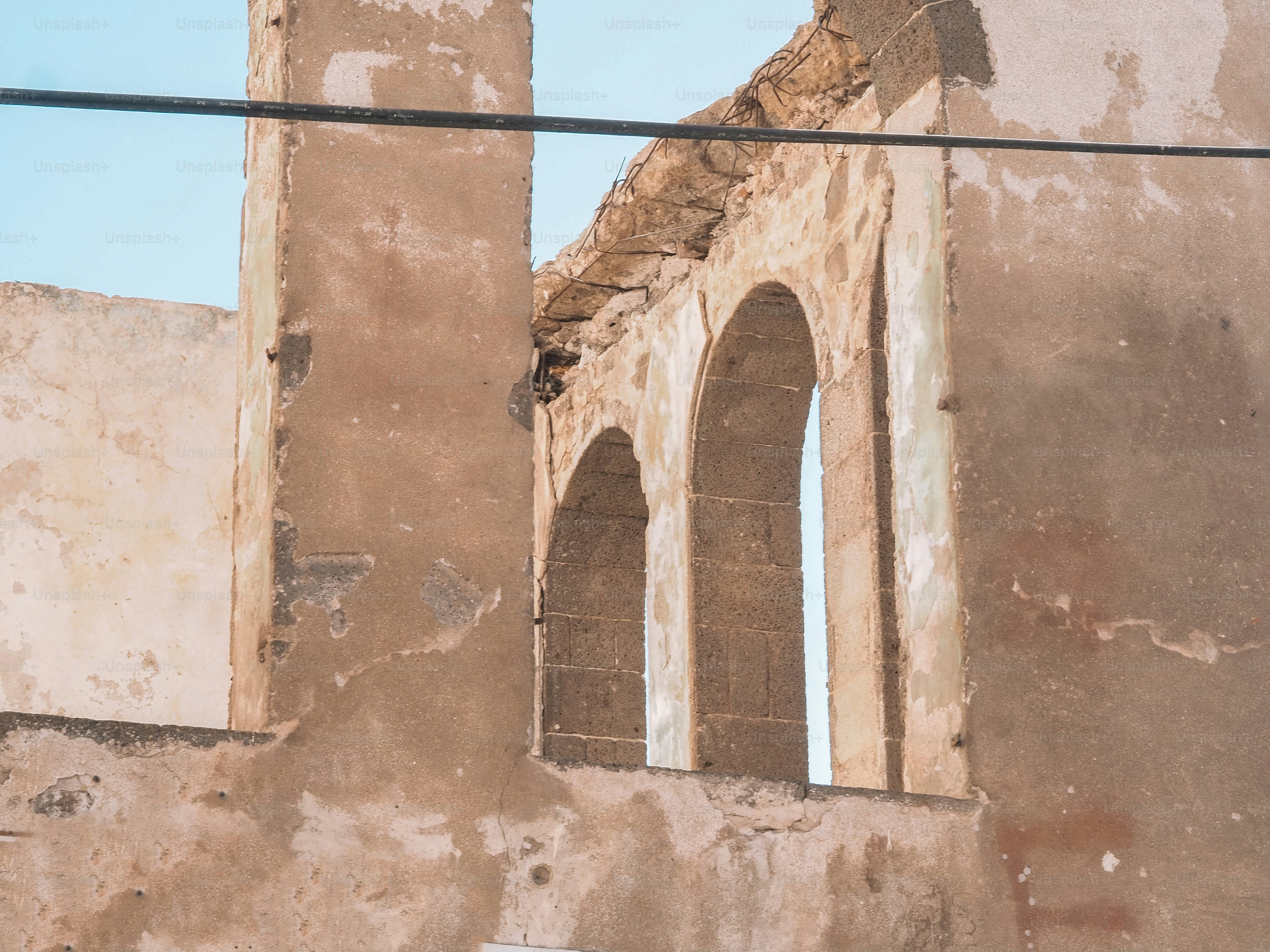 an old building with a clock on the side of it