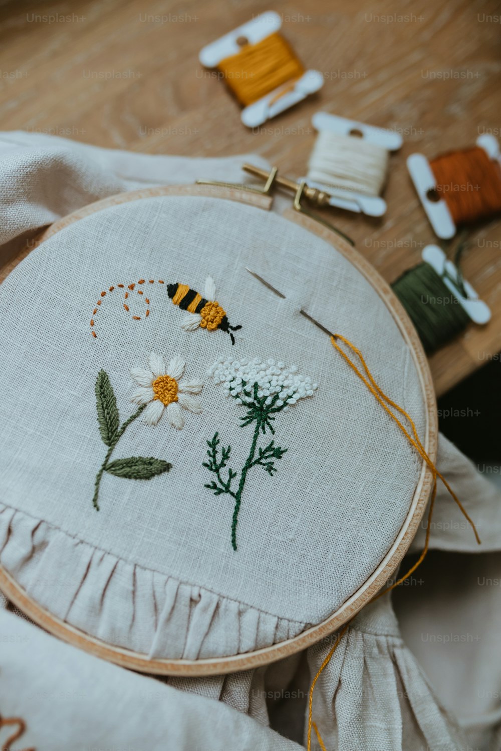 a close up of a embroidery on a table