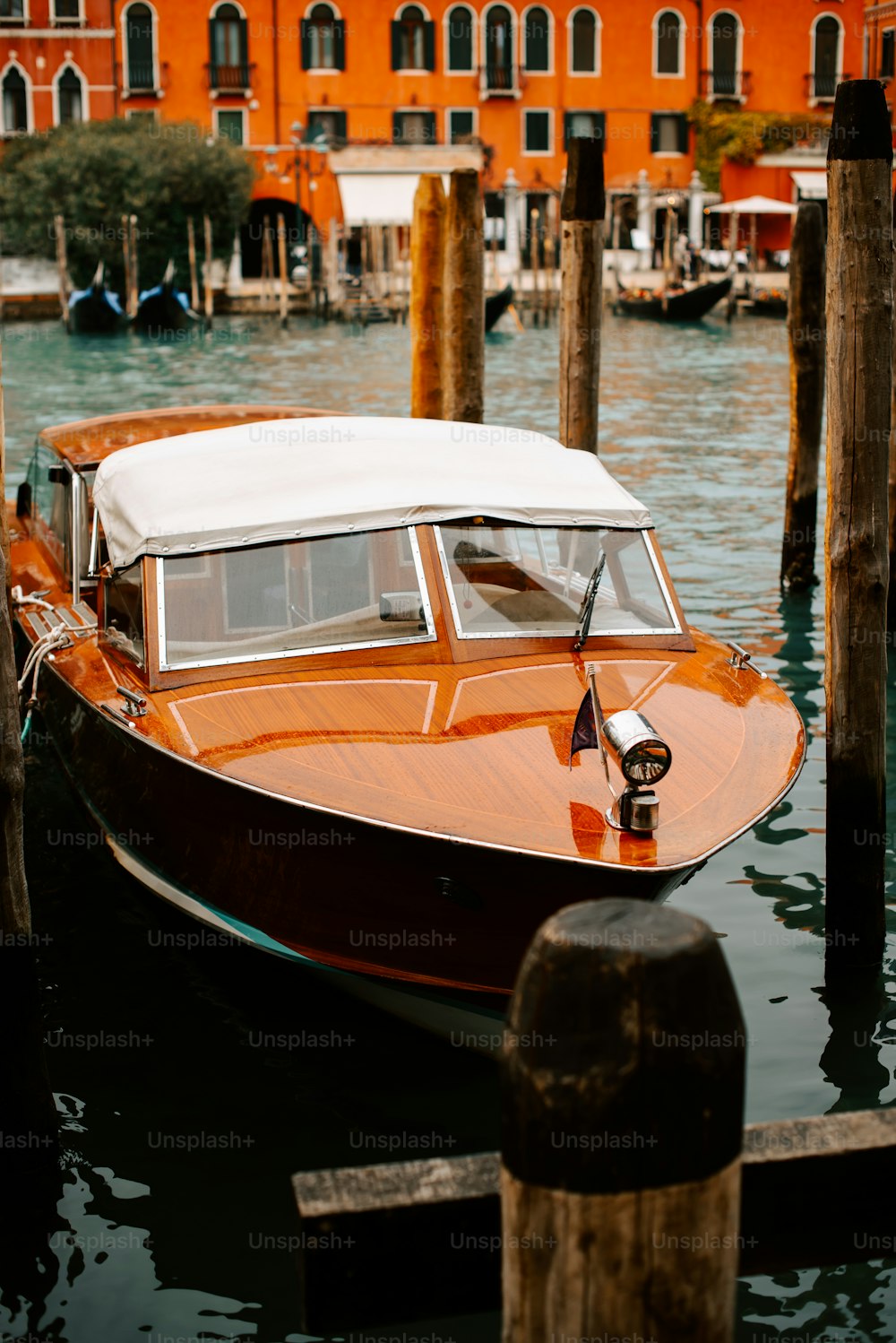 a boat is docked in the water near a building