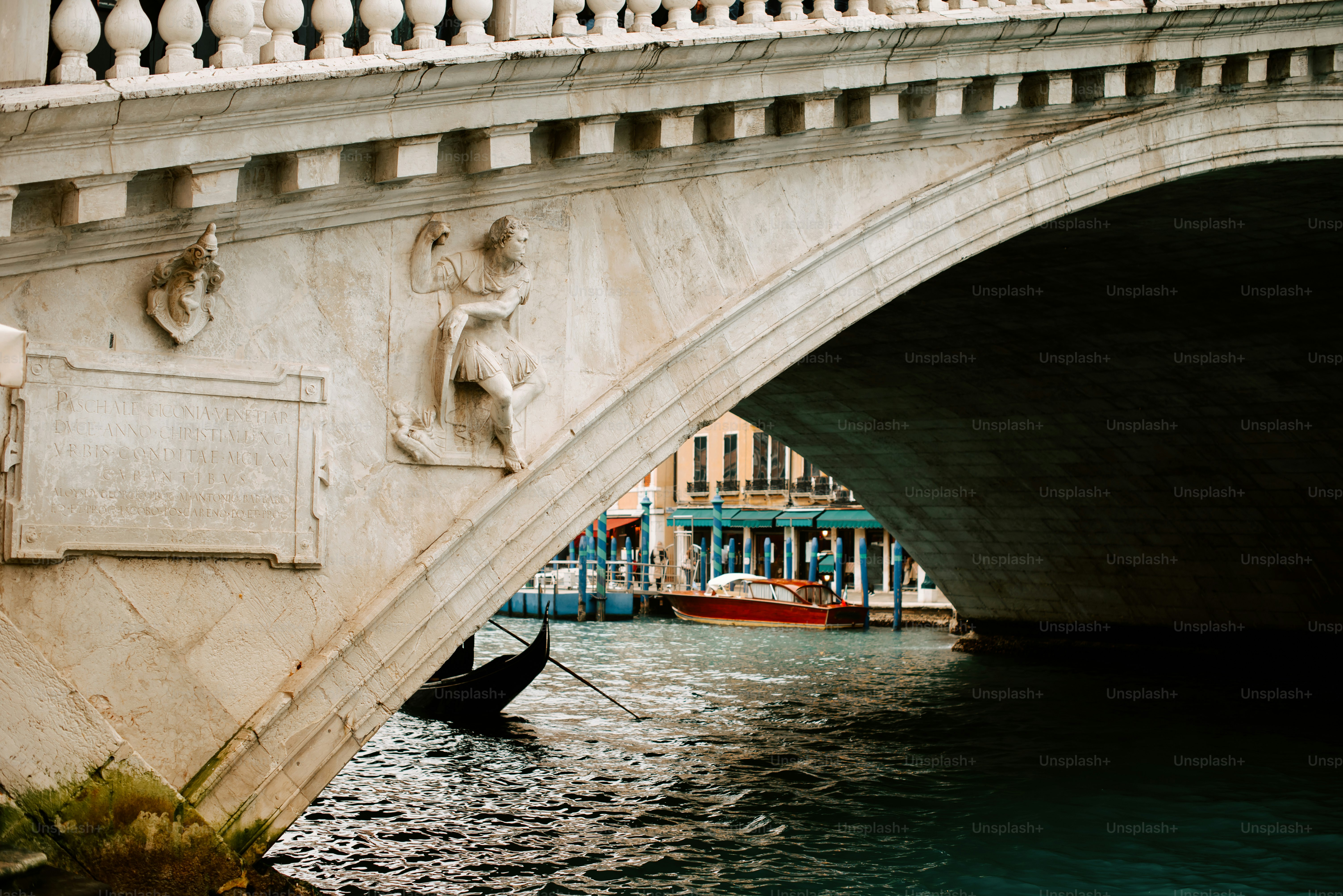 a bridge with a boat going under it