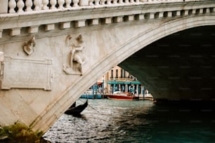 a bridge with a boat going under it