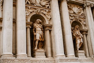 a statue on the side of a building