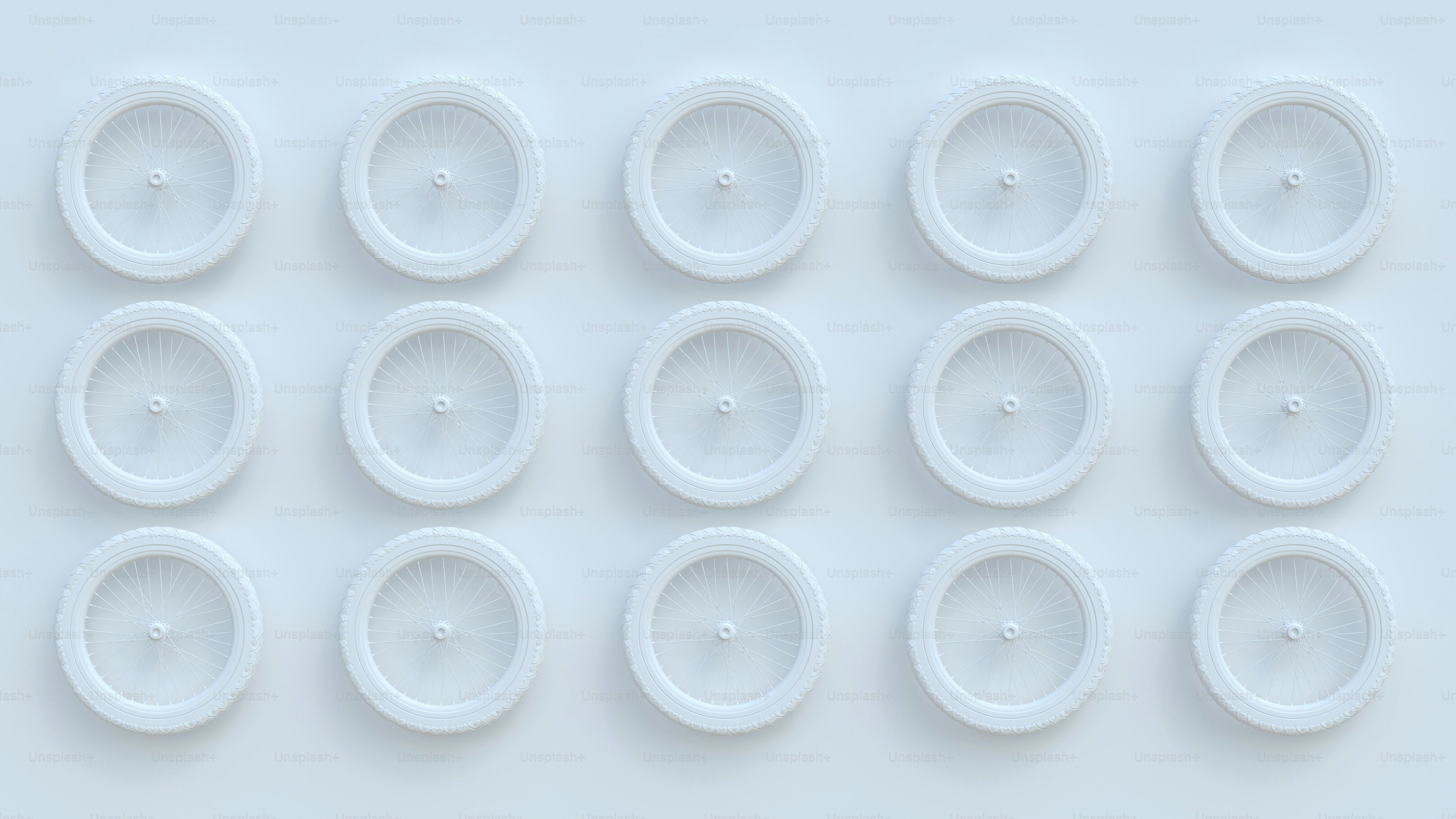 a group of white plastic wheels on a white surface
