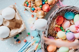 a basket filled with lots of colorful eggs