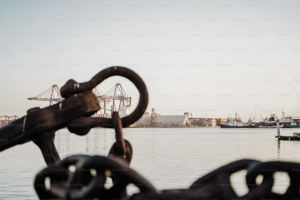 a view of a body of water with ships in the background