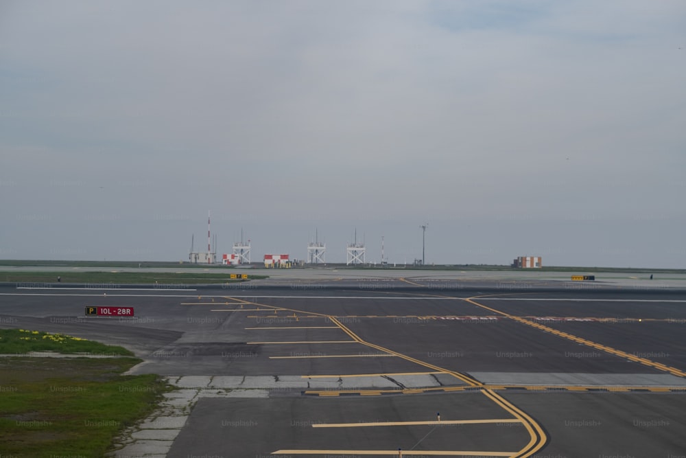 an airport runway with a few planes on it