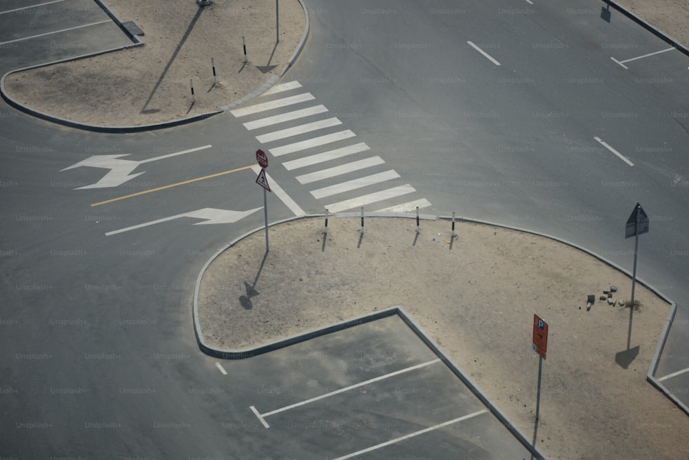 an aerial view of a street intersection with a crosswalk