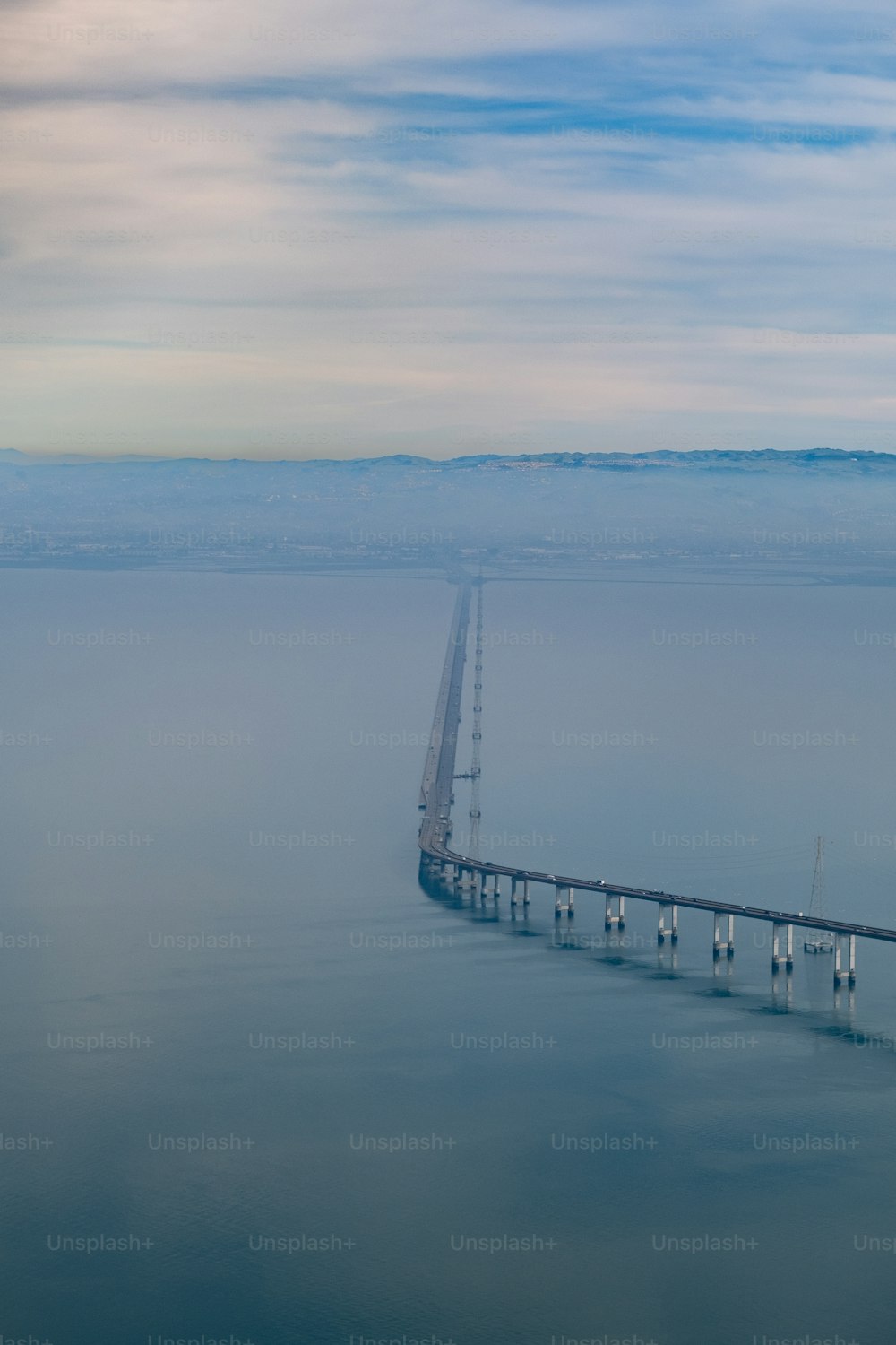 a long bridge spanning over a large body of water
