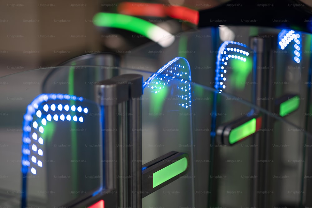 a close up of a glass table with neon signs on it