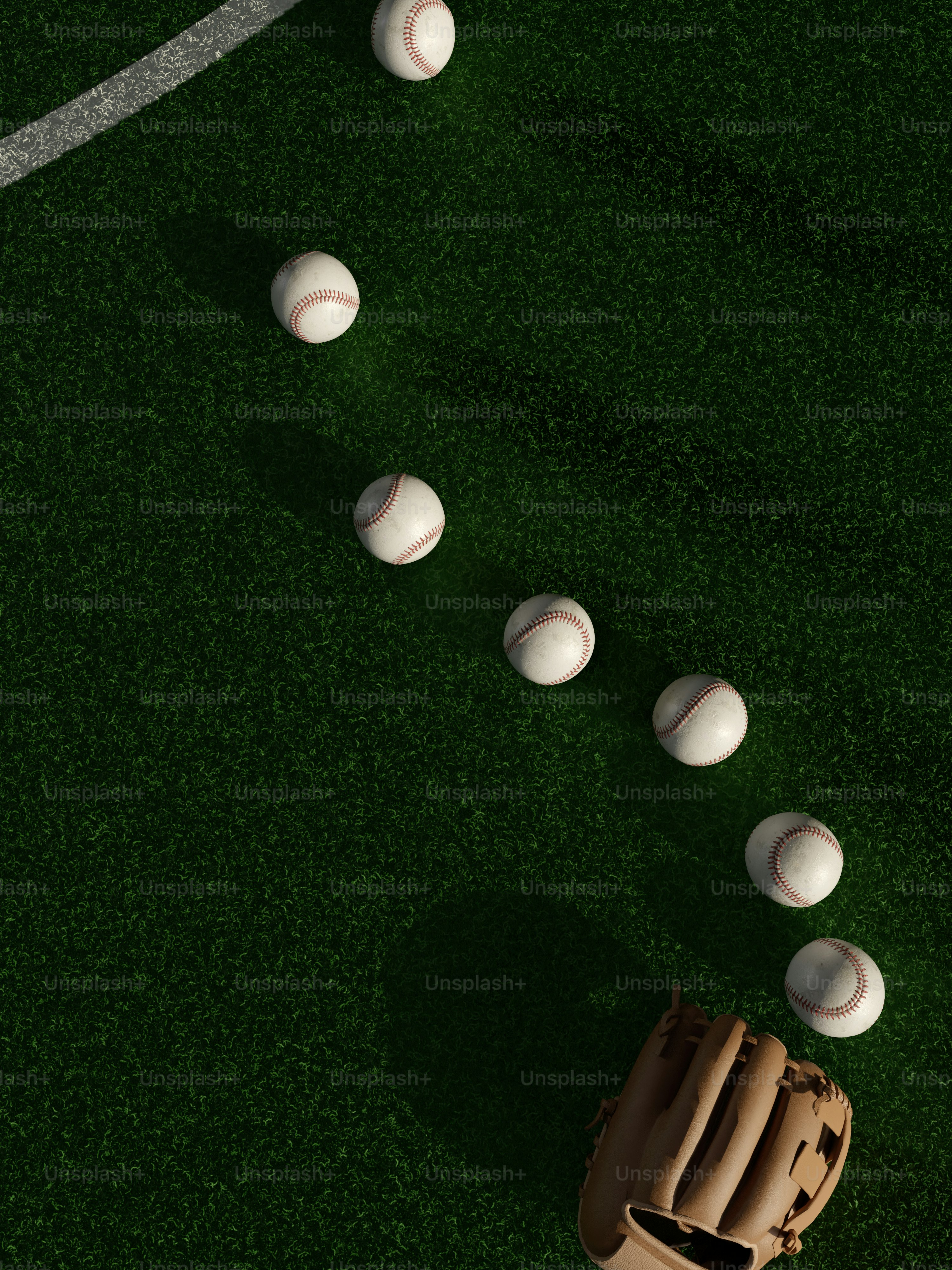 a group of baseballs sitting on top of a field