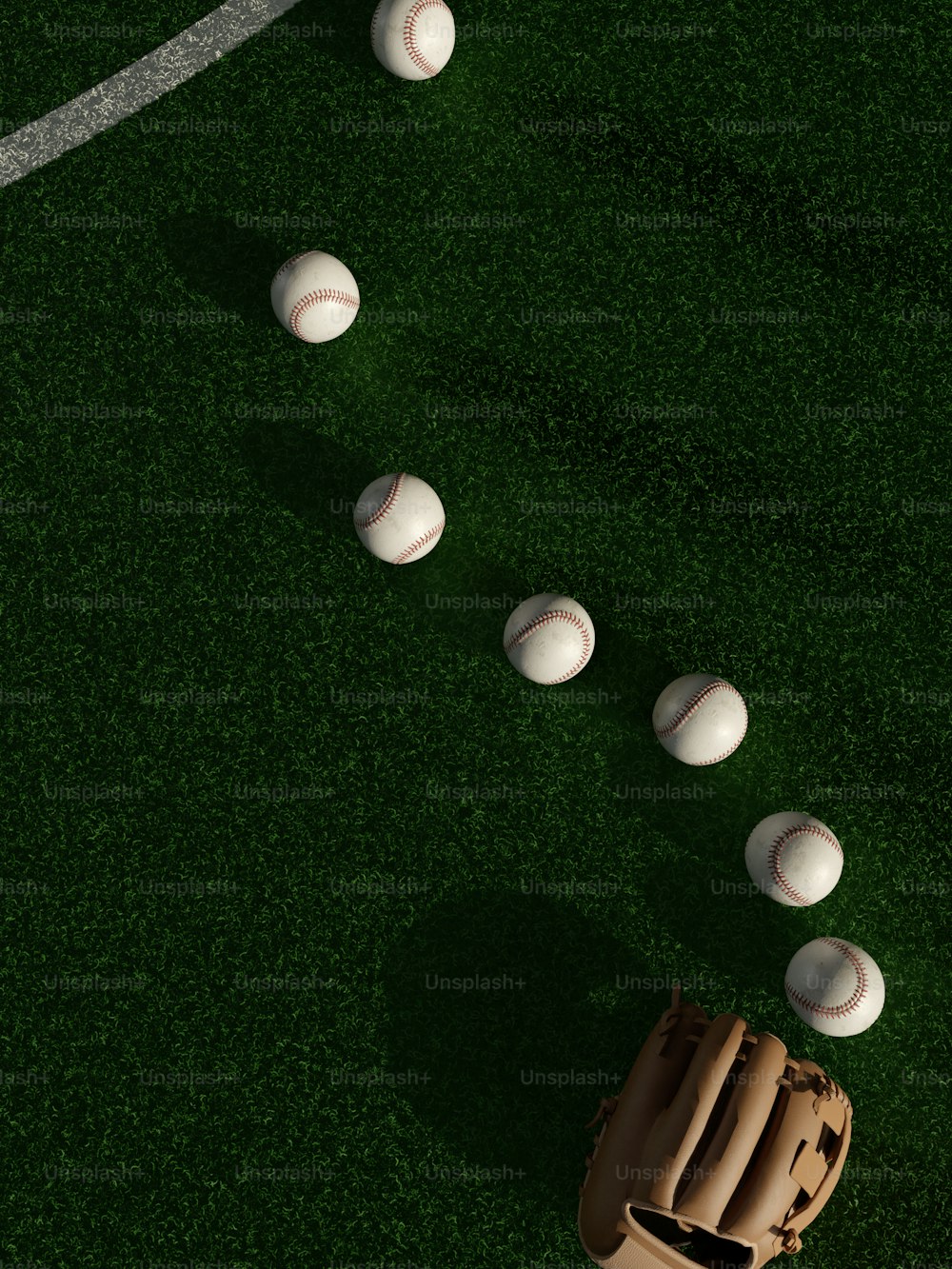 a group of baseballs sitting on top of a field
