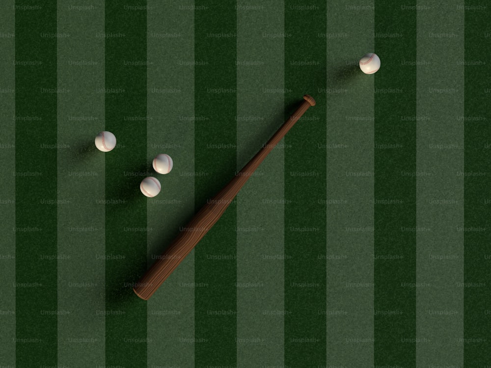 um taco de beisebol e três bolas em um campo