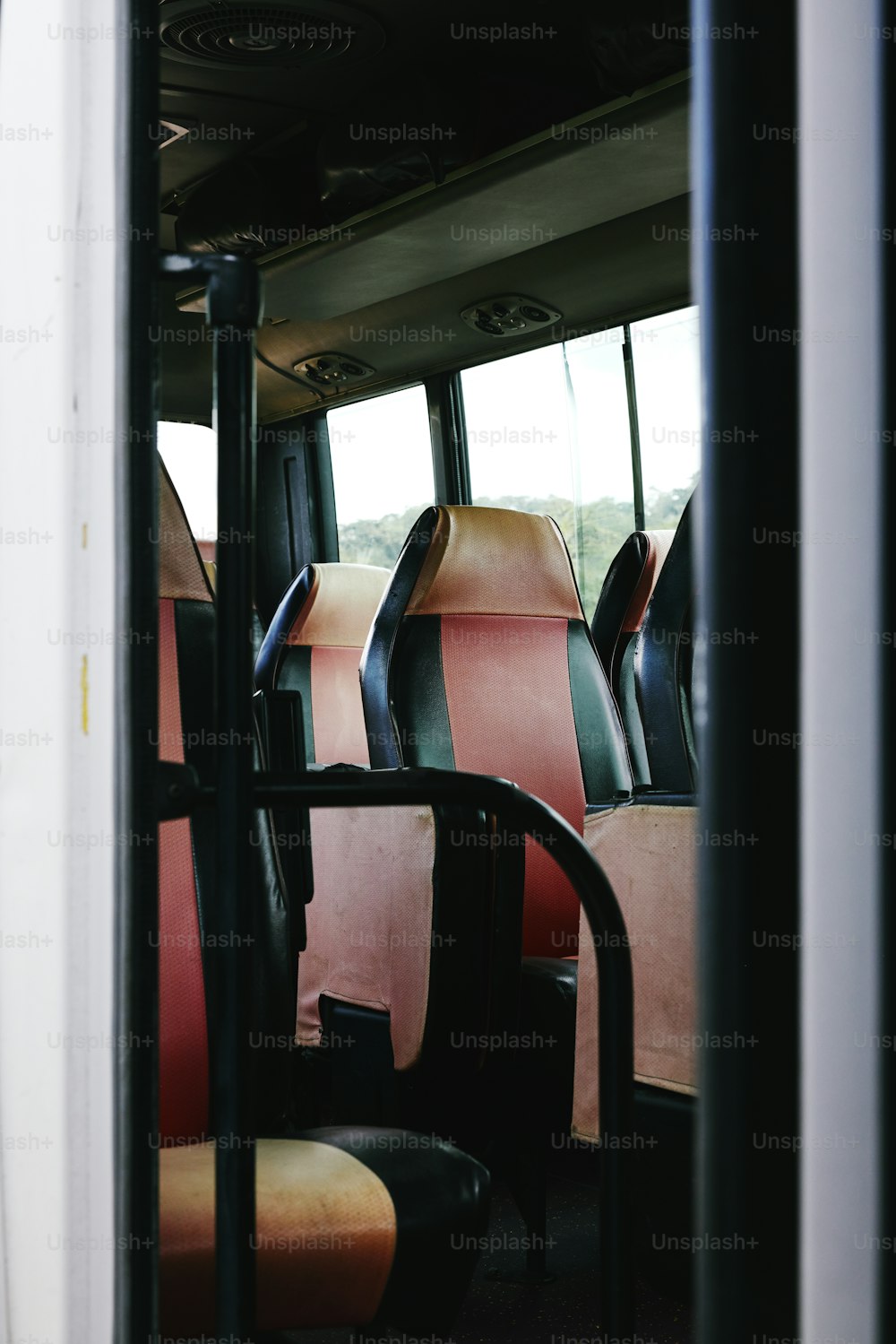 a row of seats sitting inside of a bus