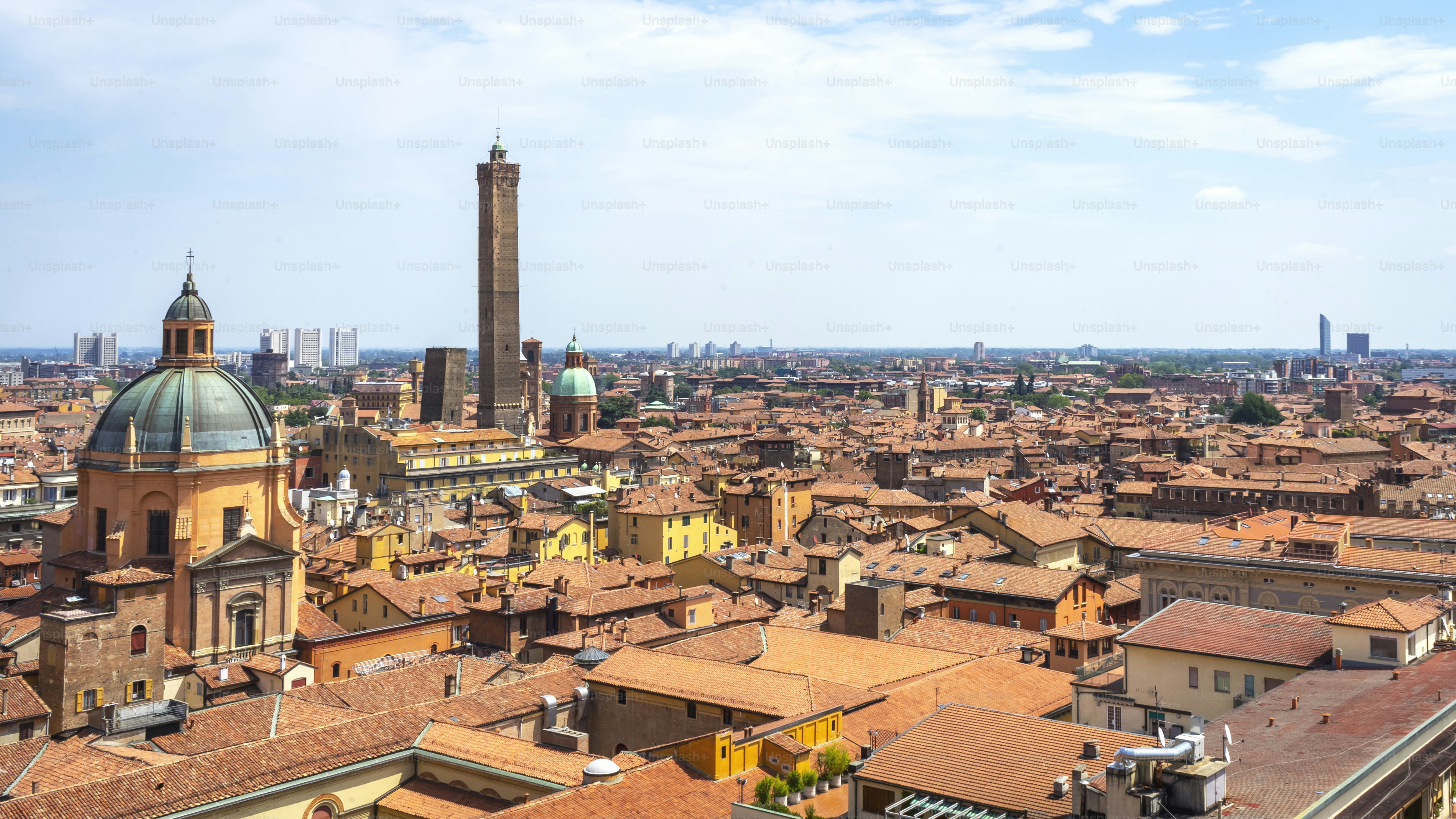 a view of a city with tall buildings and a clock tower
