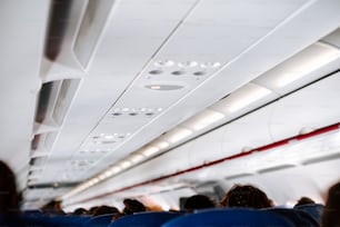 a group of people sitting on an airplane