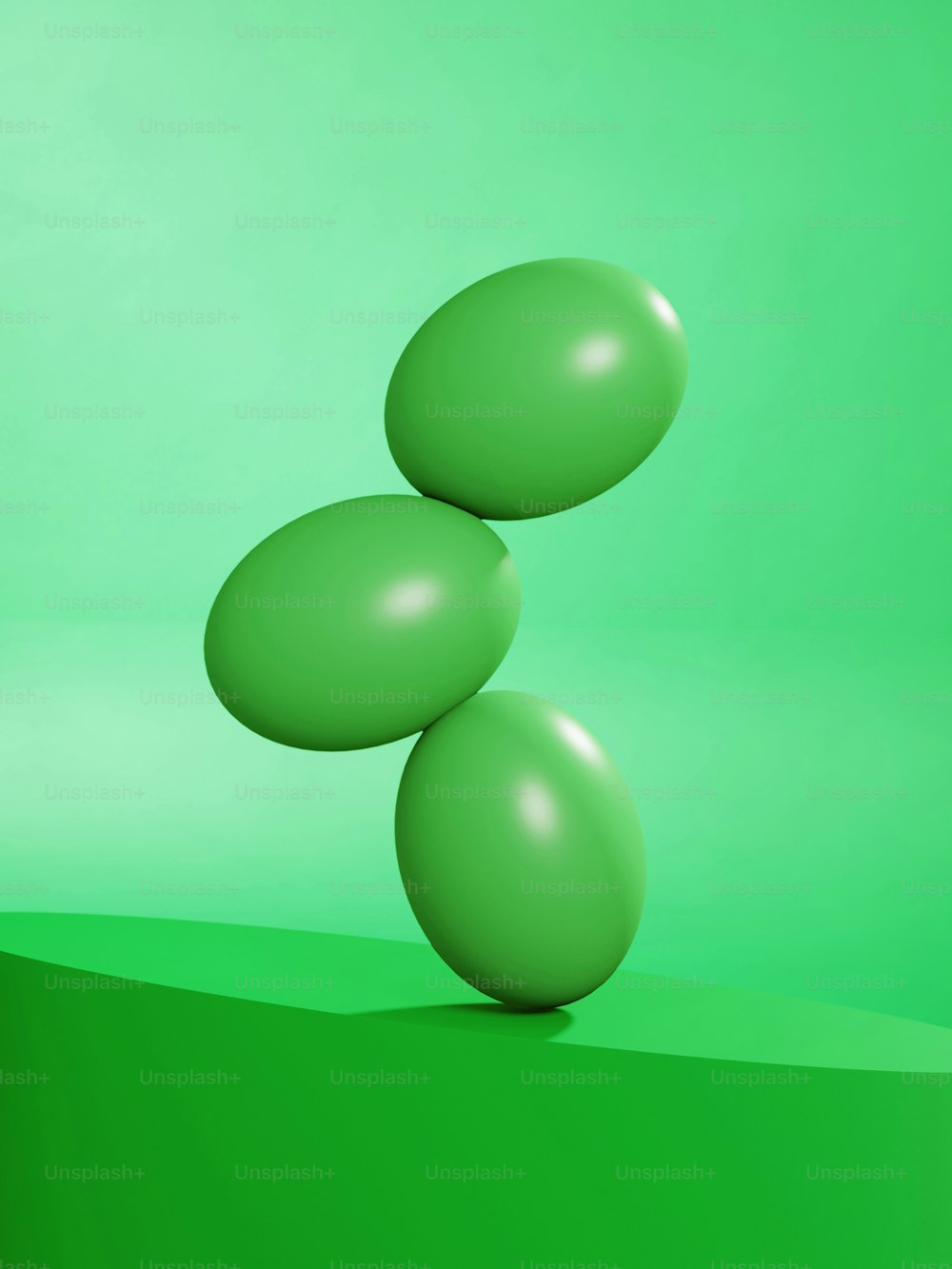 um fundo verde com três balões flutuando no ar