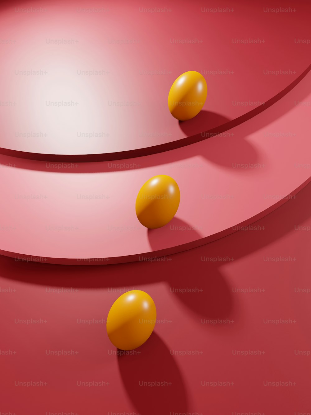 a red table with three yellow balls on it