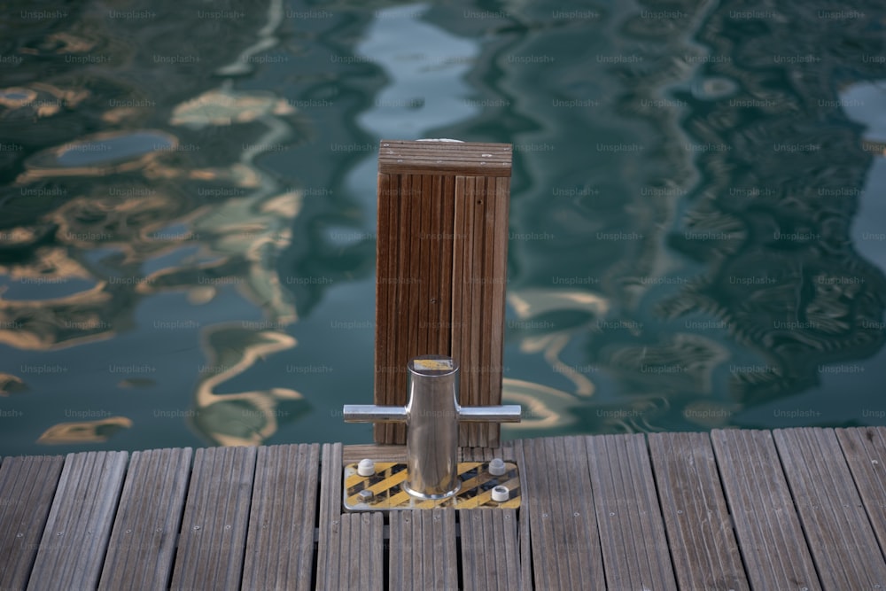 a wooden dock next to a body of water