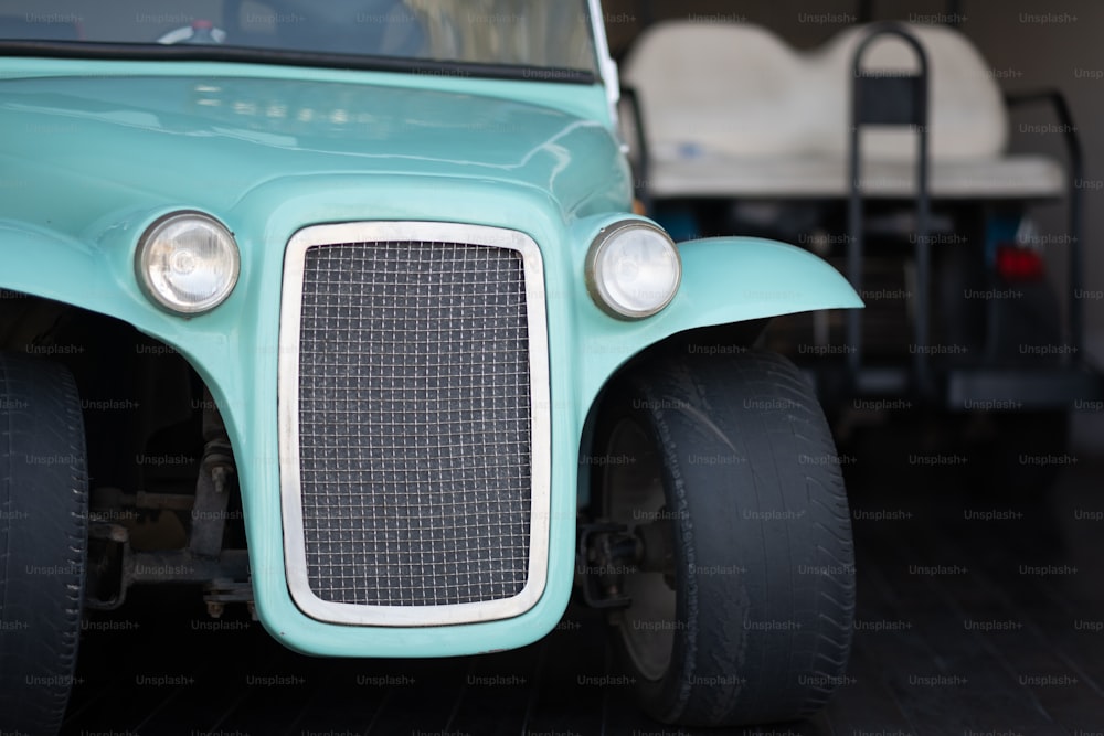 a close up of the front end of a green vehicle