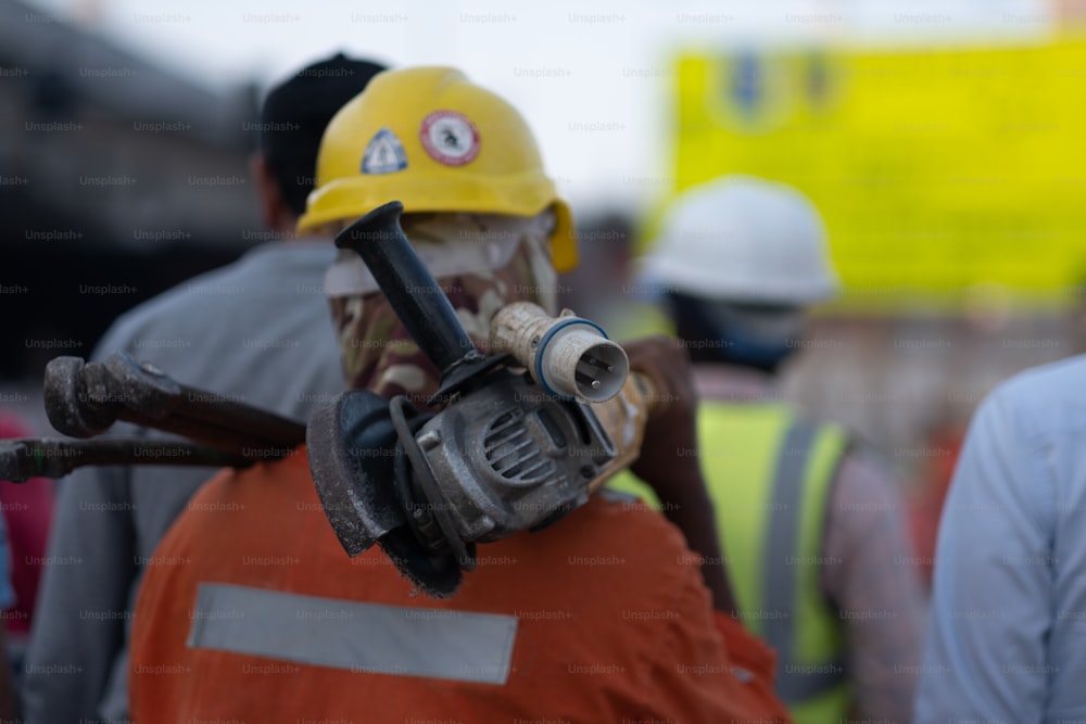 a man wearing a hard hat and a gas mask