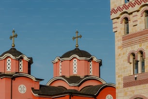 a red church with two crosses on top of it