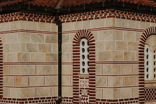 a clock on the side of a brick building