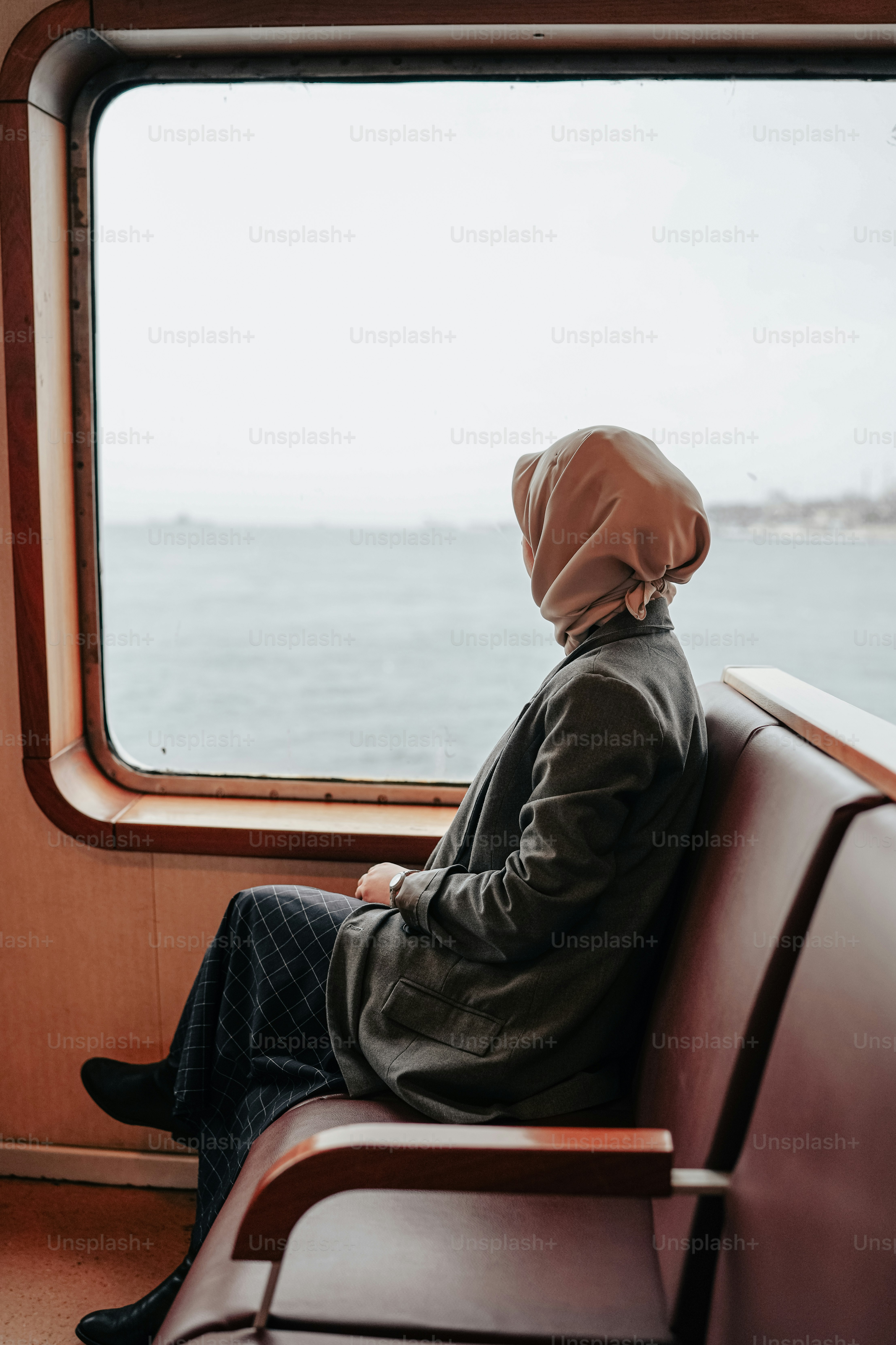a person sitting on a train looking out the window
