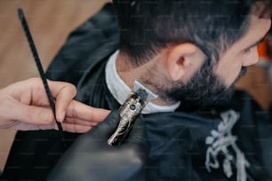 a man cutting another mans hair with scissors