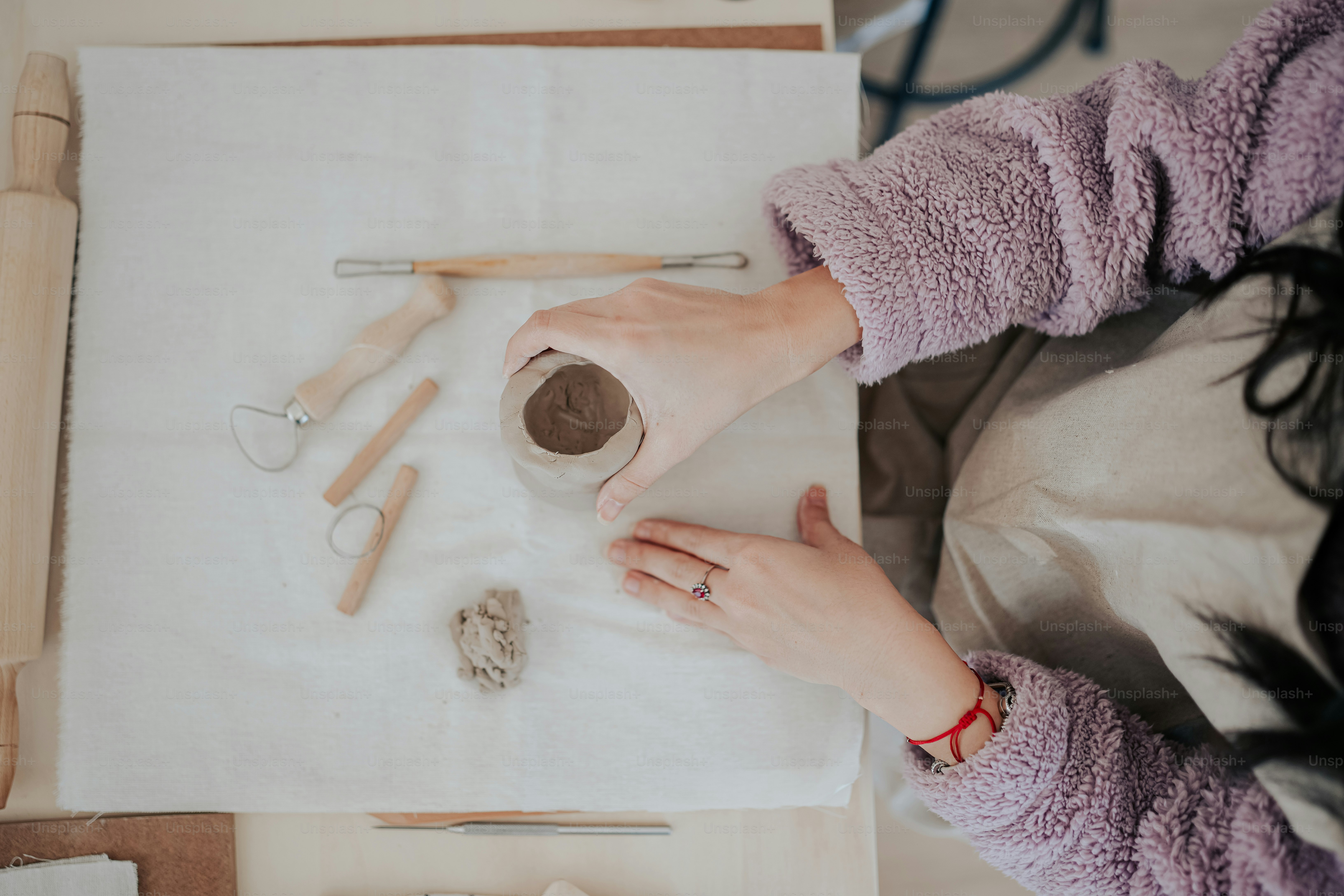 A woman is working on a craft project photo – Hands Image on Unsplash