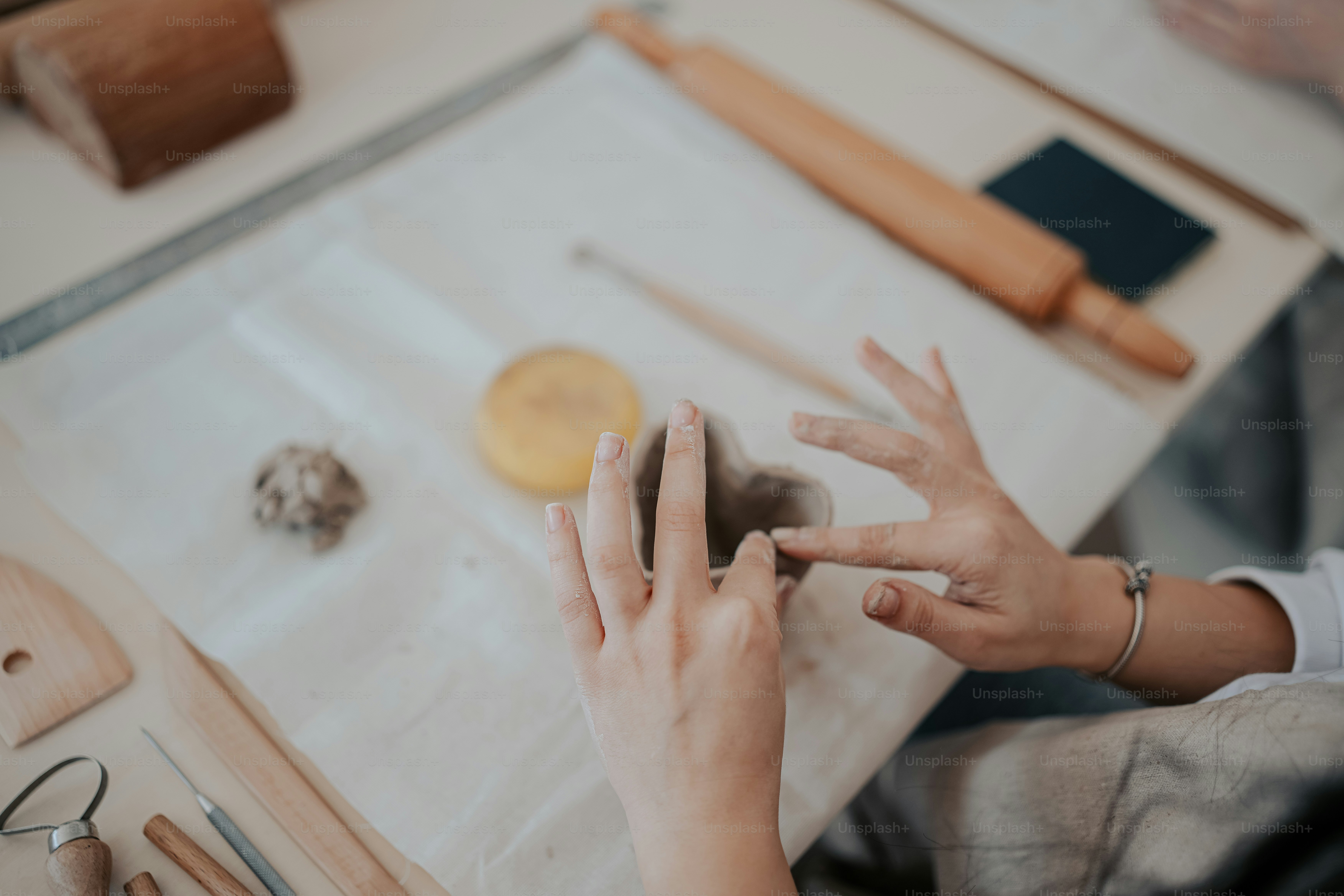 a woman is doing crafts with her hands