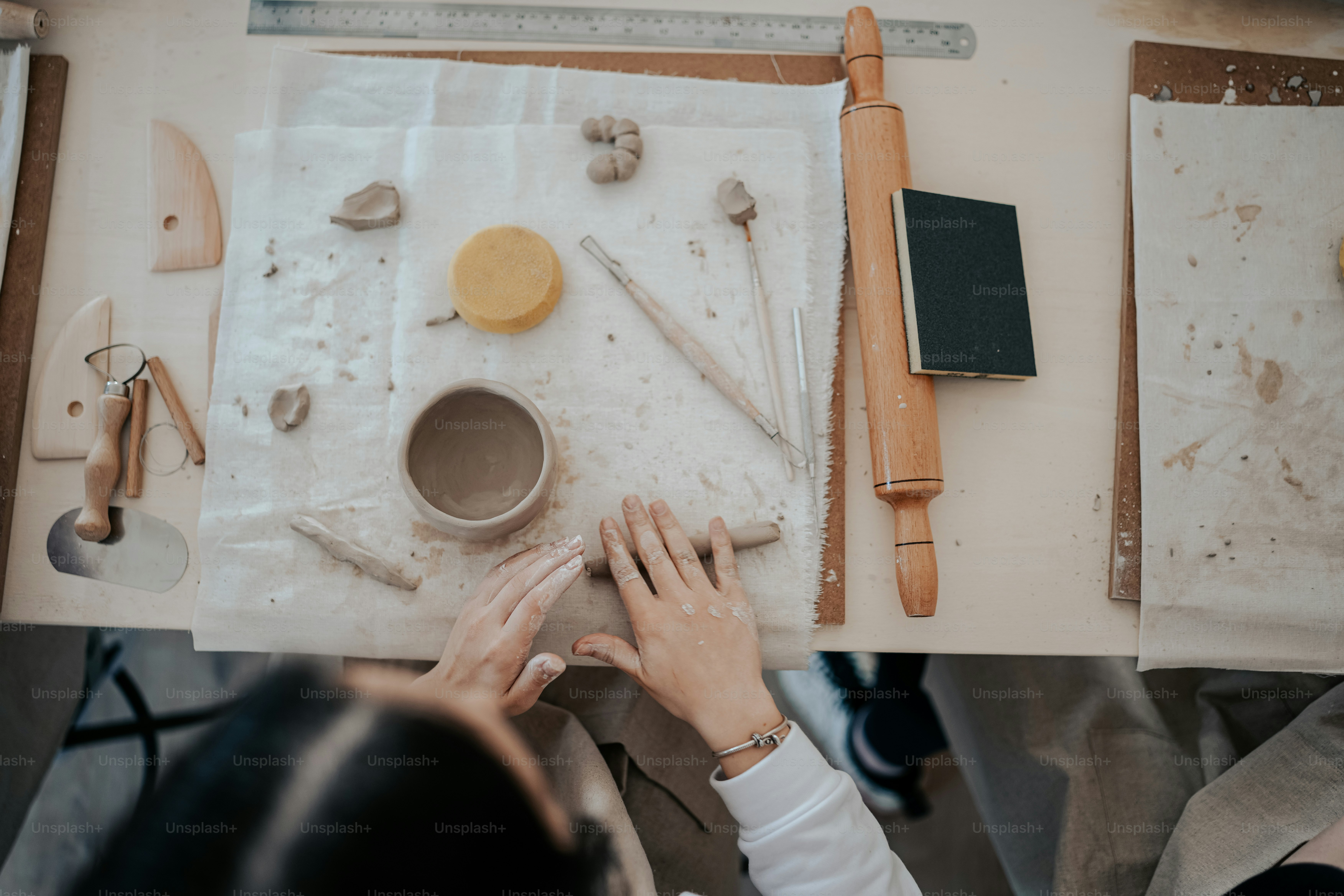 a woman is working on a craft project
