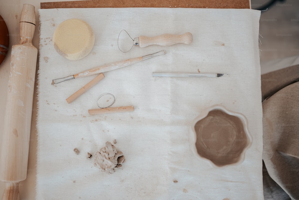 a table topped with lots of craft supplies