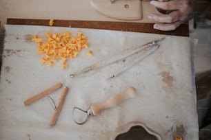 a pair of scissors and some cheese on a cutting board