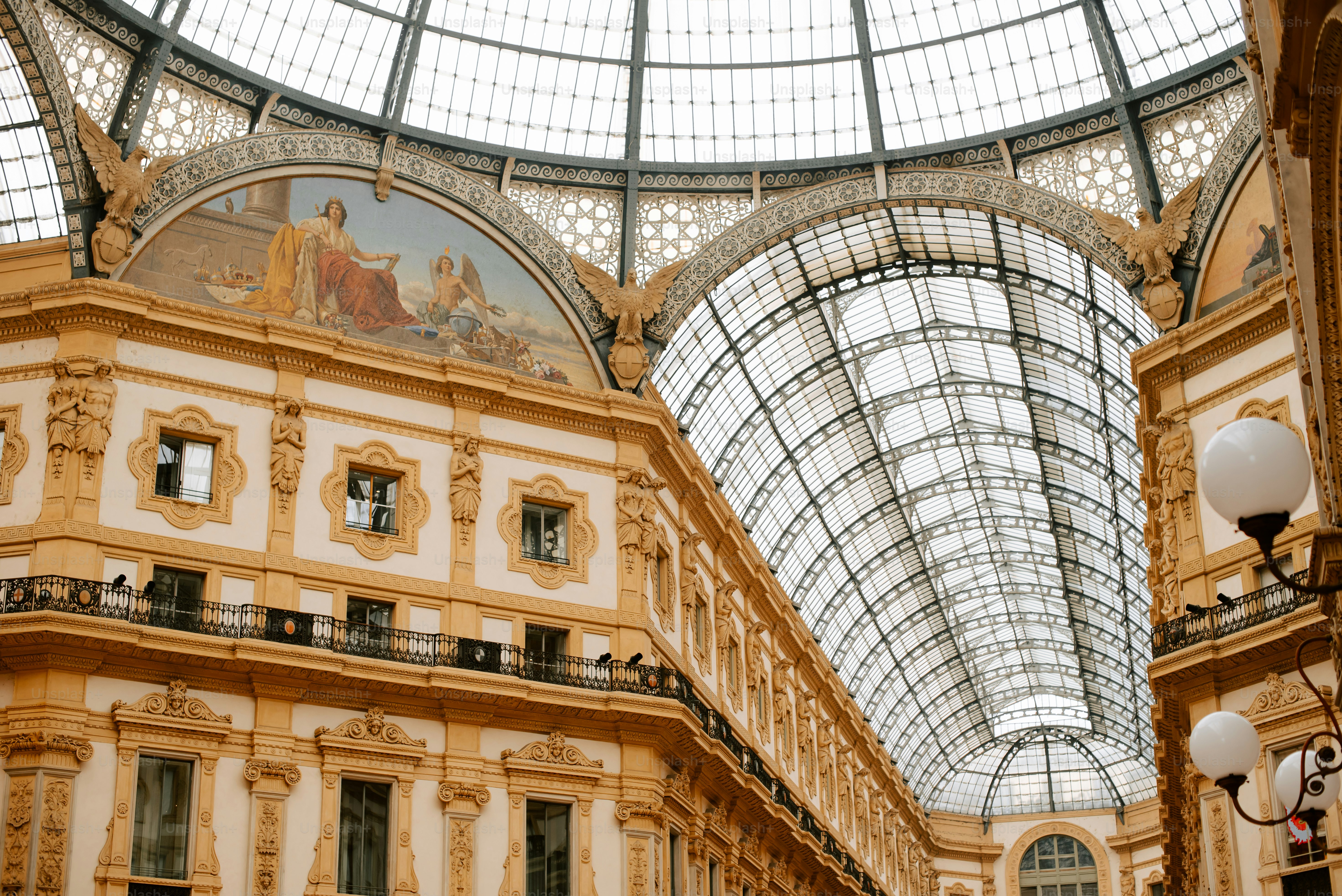 a building with a glass ceiling and a clock