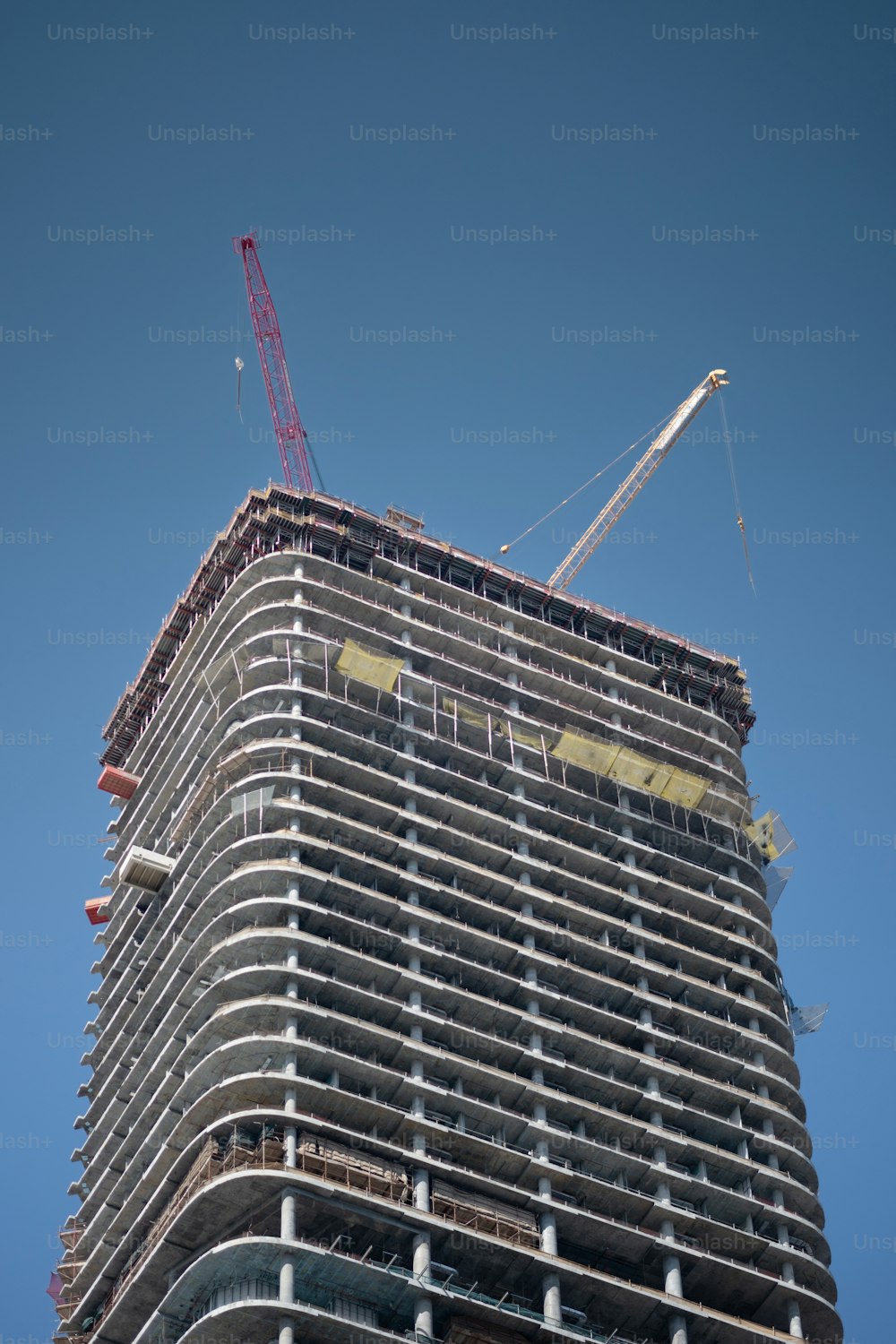 a tall building with a crane on top of it