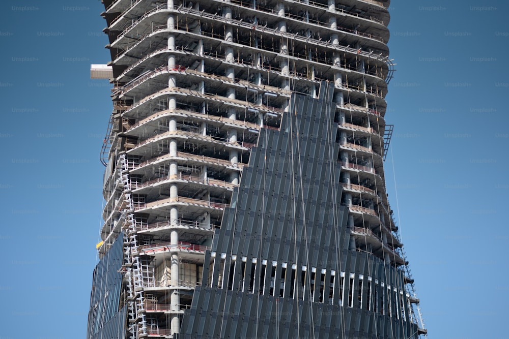 a very tall building with a clock on it's side